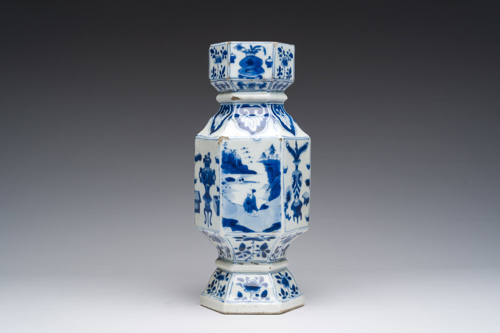 A Chinese blue and white hexagonal vase with figures in a landscape and antiquities, Kangxi (1 of 6)
