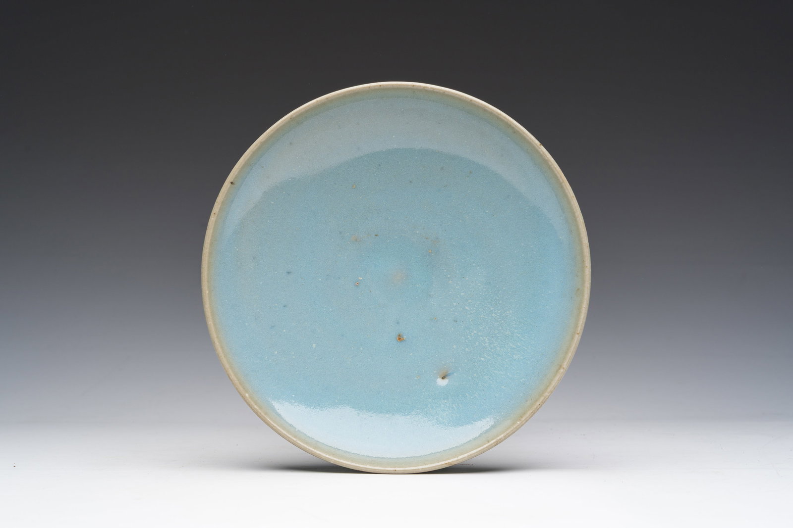 A Chinese monochrome 'jun' plate, Song (1 of 2)