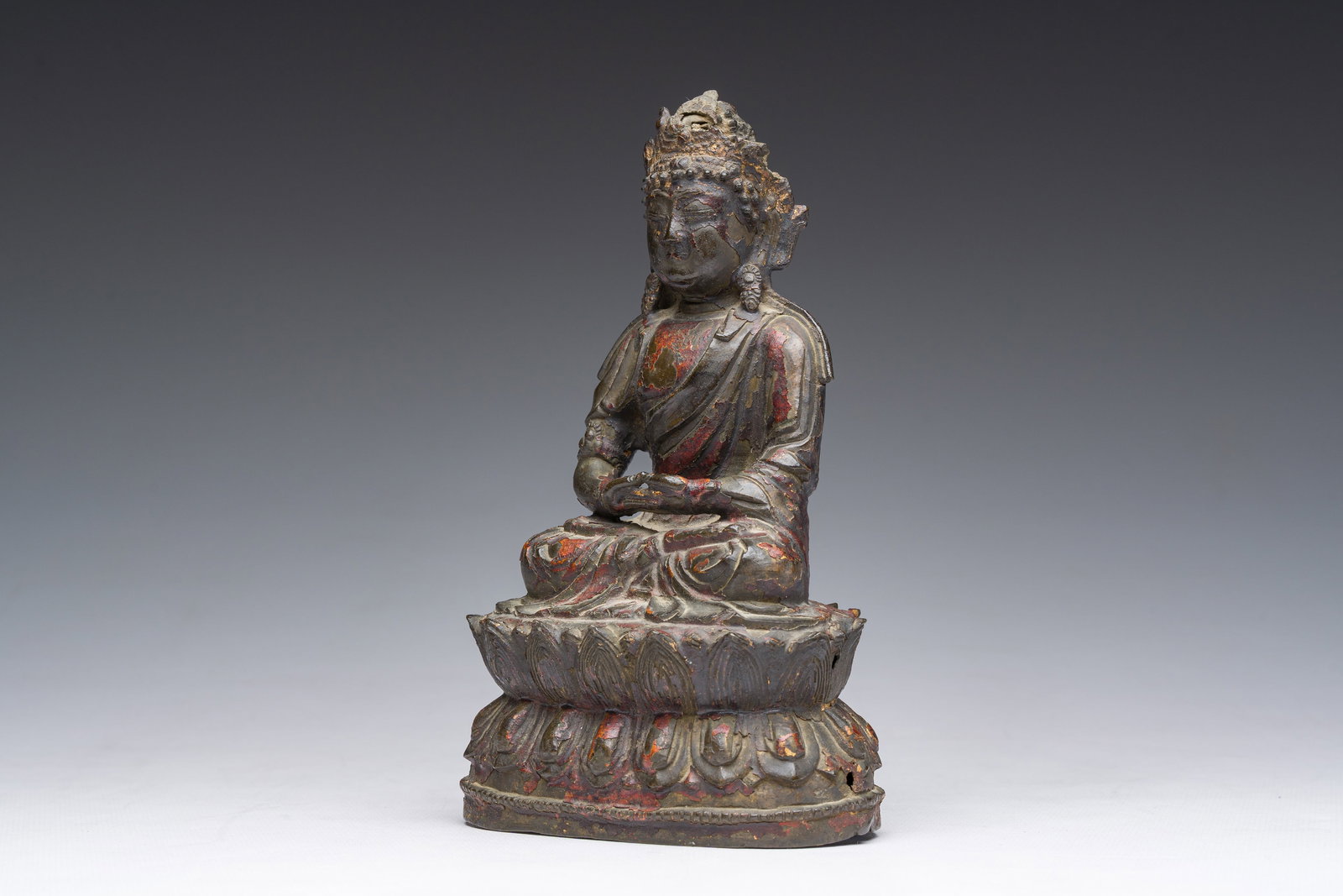 A Chinese gilt lacquered bronze sculpture of a seated Buddha, Ming (1 of 8)