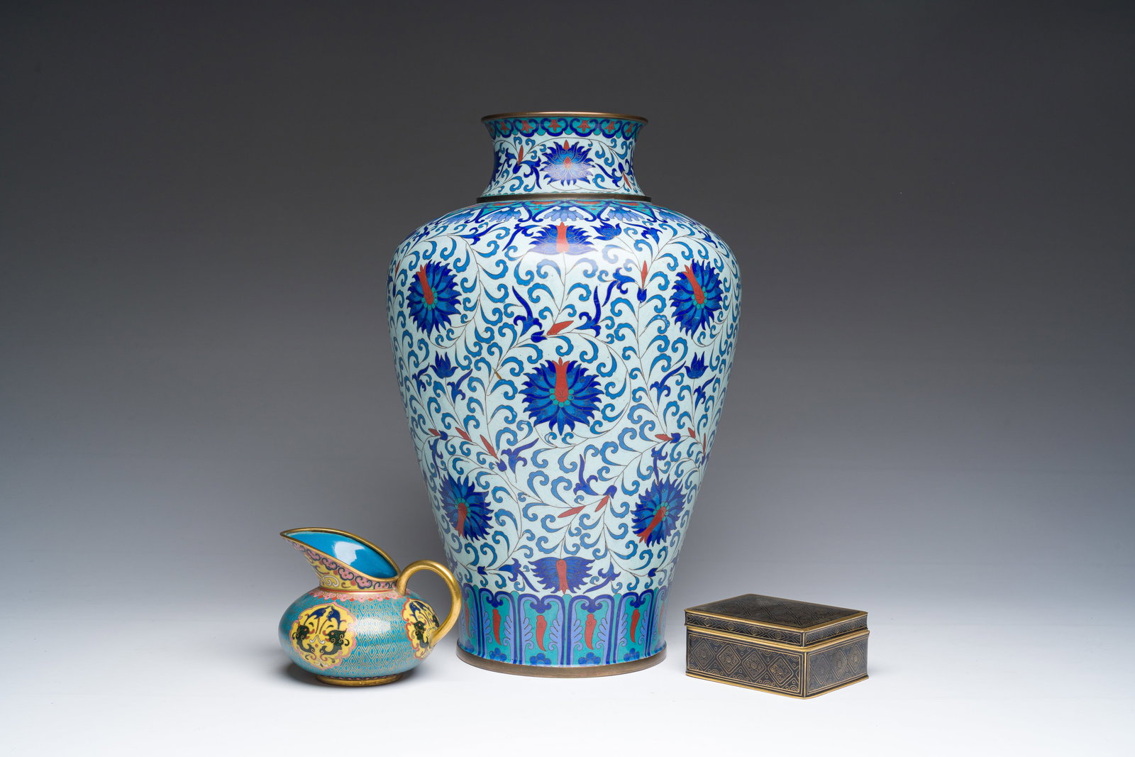 A Chinese cloisonne 'meiping' vase with lotus scrolls, a ewer and a rectangular box and cover, (1 of 9)