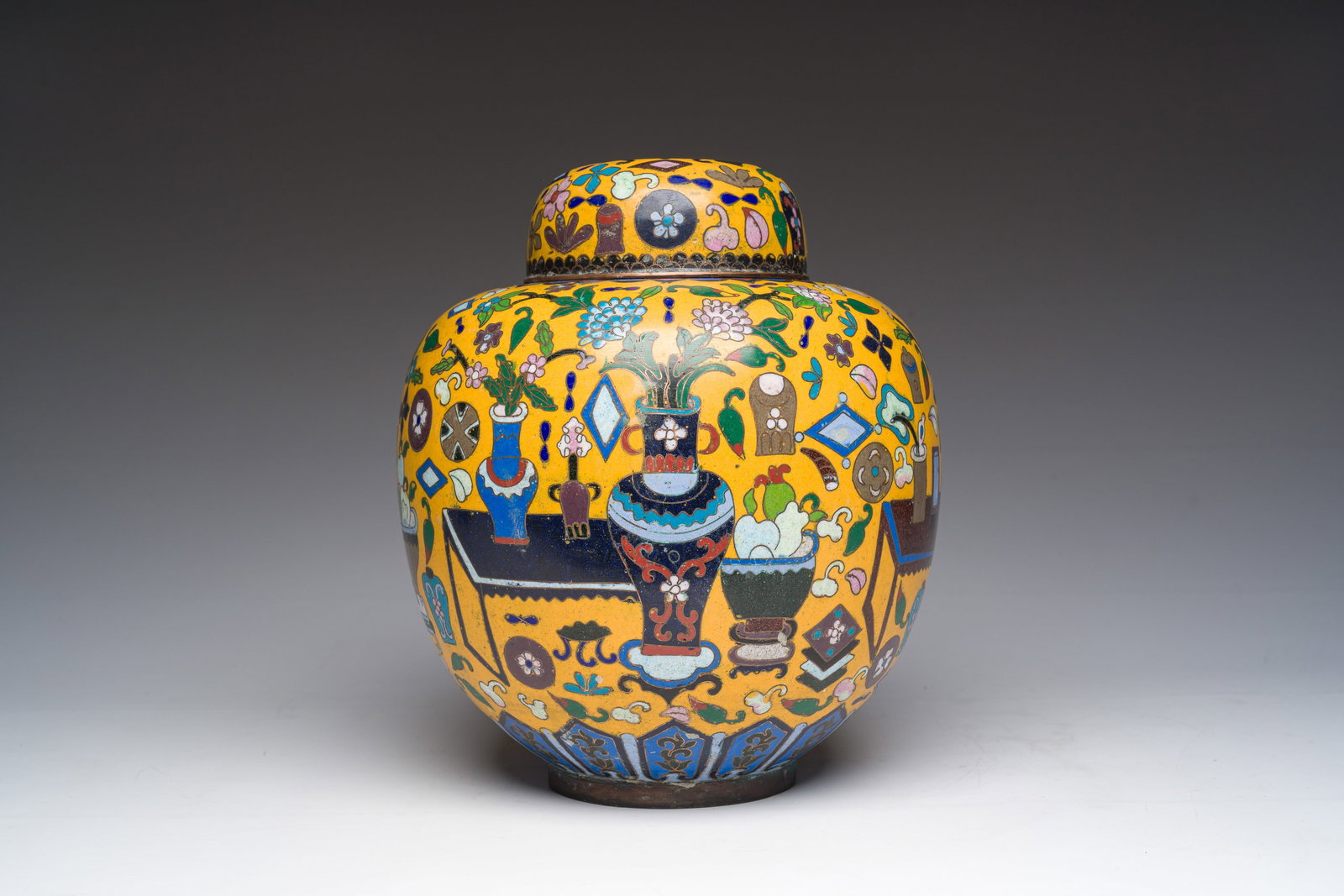 A Chinese cloisonne yellow-ground 'antiquities' jar and cover, 19th C. (1 of 6)
