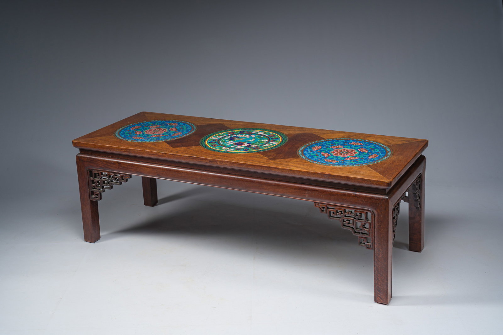 A Chinese rectangular wooden table inlaid with three round cloisonne plaques with floral design, (1 of 7)