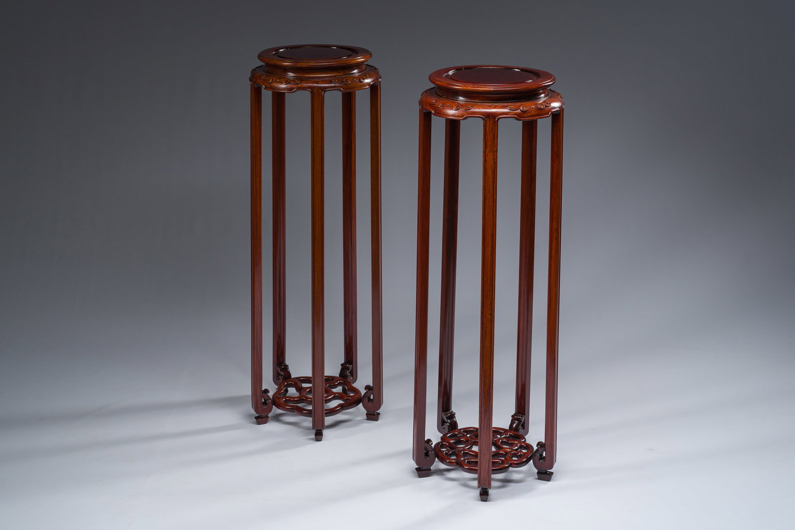 A pair of Chinese carved wooden stands, 20th C. (1 of 9)