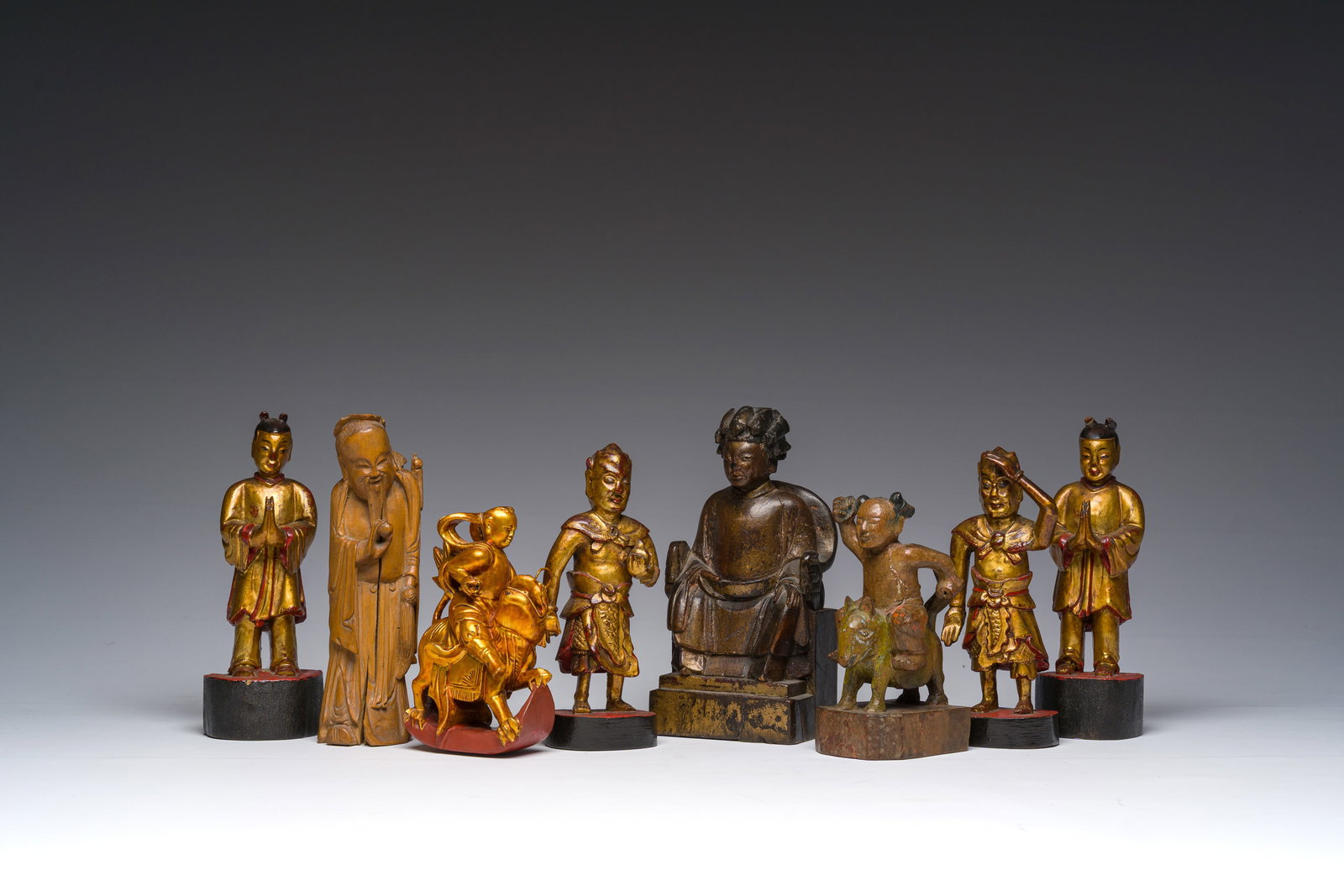 Eight Chinese gilt and polychromed wooden sculptures, 19th/20th C. (1 of 7)