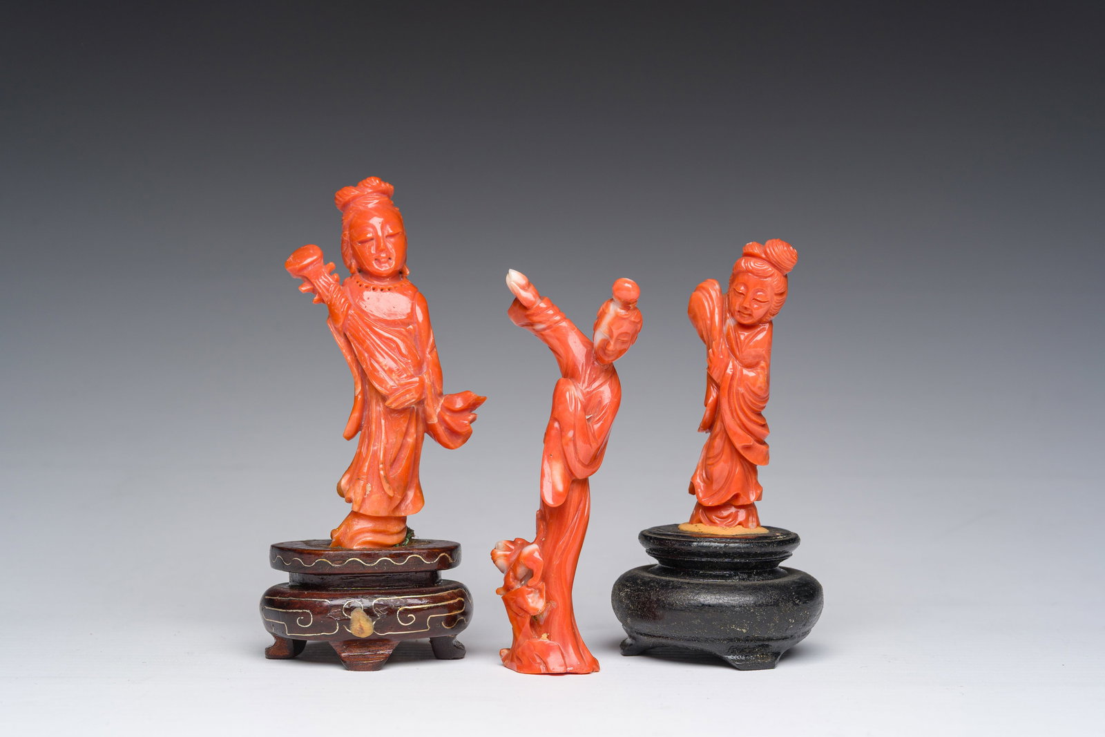 Three Chinese carved red coral figures of a lady, 19th/20th C. (1 of 7)