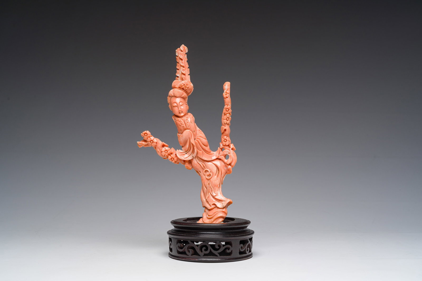 A Chinese carved red coral figure of a Guanyin, 19th/20th C. (1 of 8)