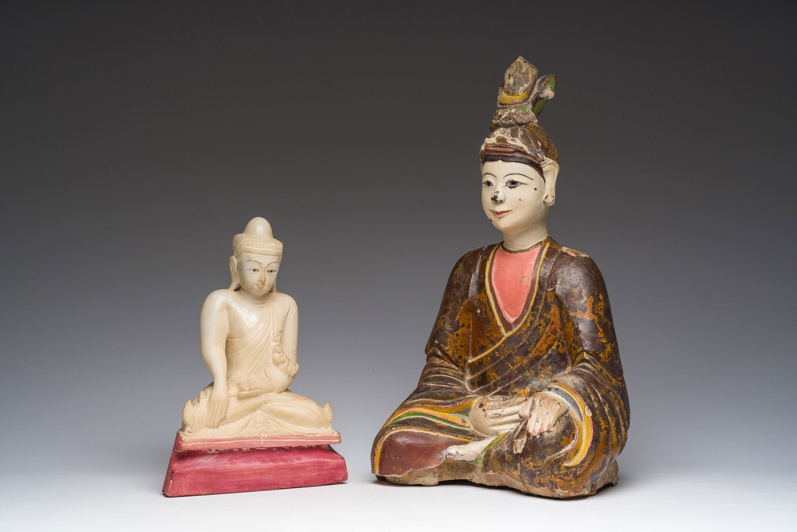 A Burmese white marble Buddha and a polychromed wood Buddha, 20th C. (1 of 7)