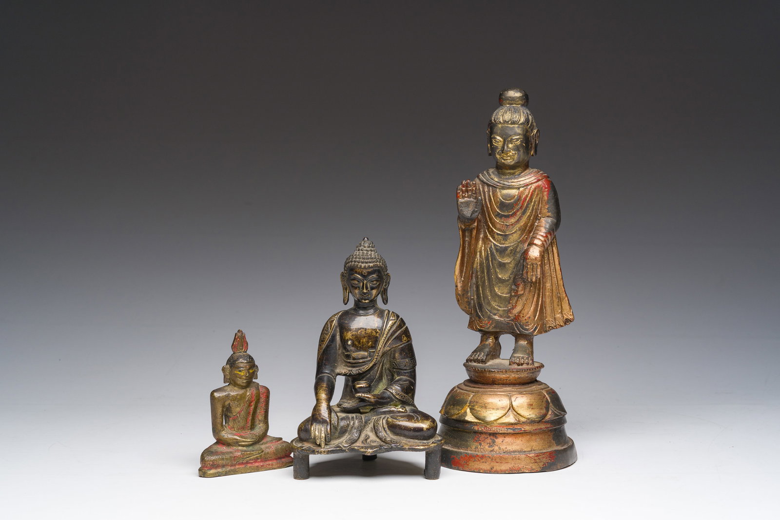 Three gilt-lacquered bronze Buddha sculptures, Corea, Tibet and Sri Lanka, 19th C. (1 of 7)