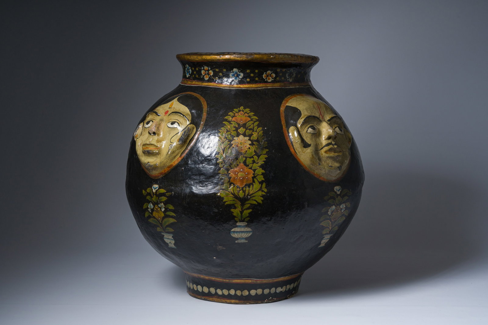 An Indian Kashmir relief decorated papier-mâche vase with four faces, 19th C. (1 of 8)