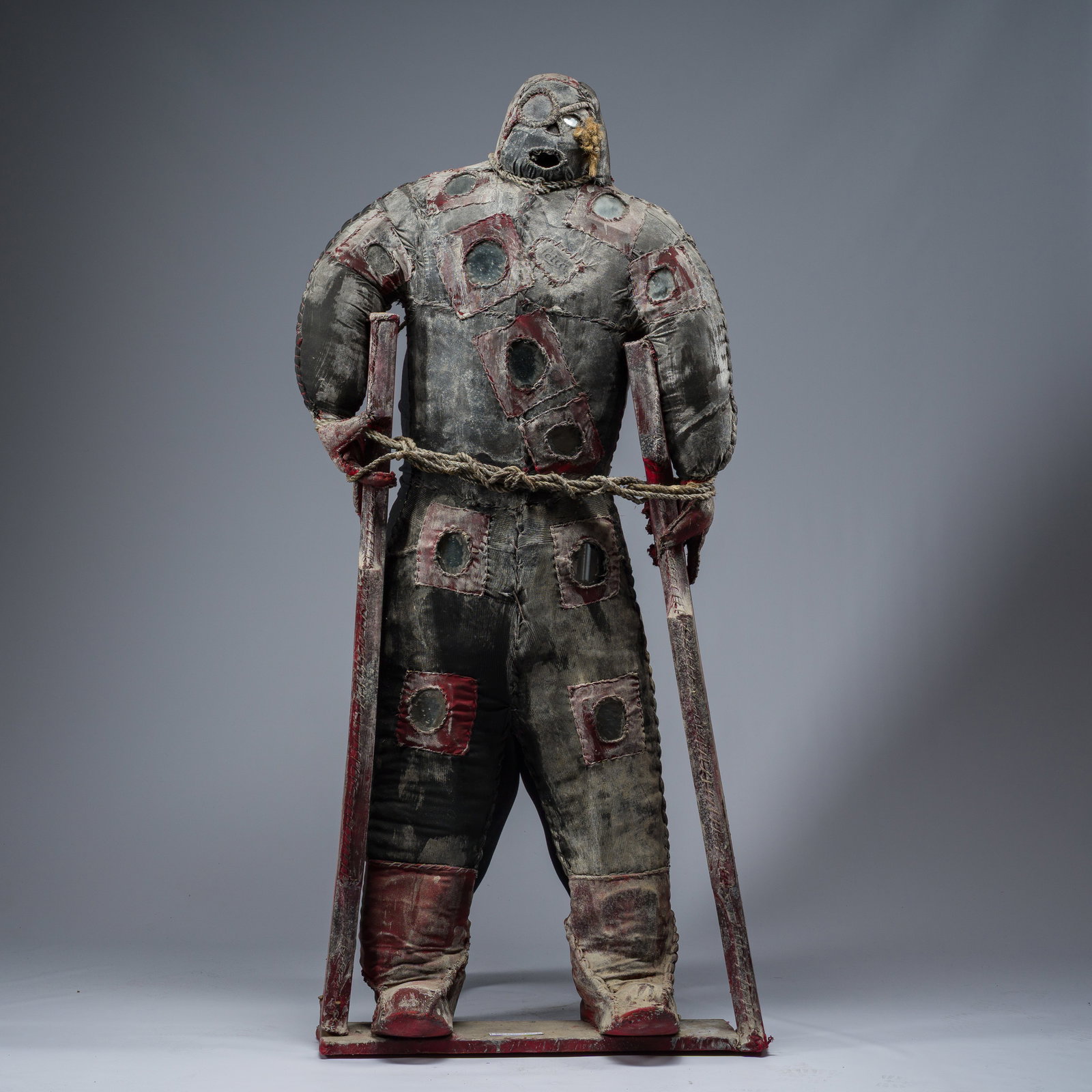 A Haitian Bizango sculpture of a crippled, one-eyed warrior standing upright with the aid of wooden (1 of 6)