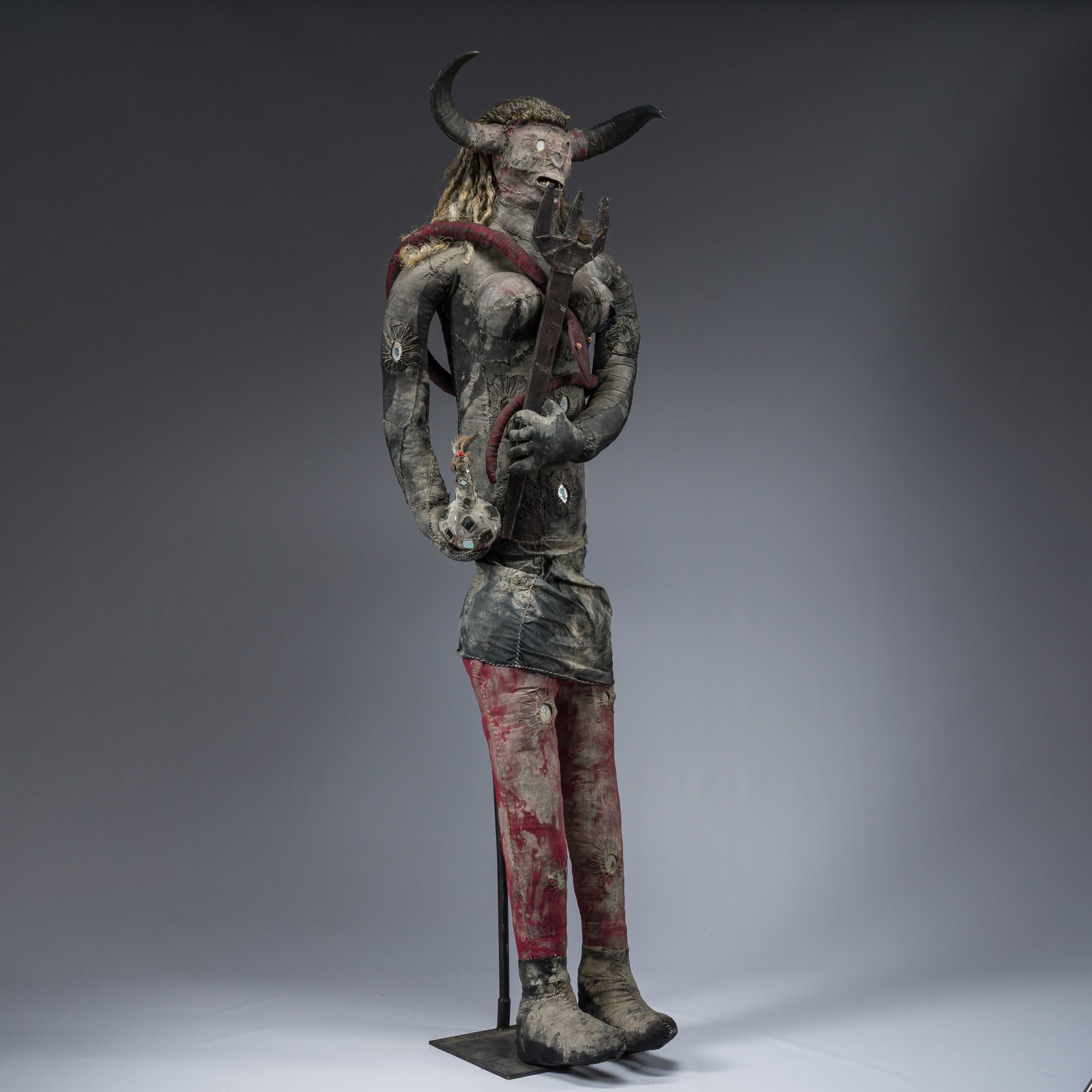 A rare Haitian Bizango sculpture of a female devil with a trident and a bottle, mixed media, 20th C. (1 of 10)