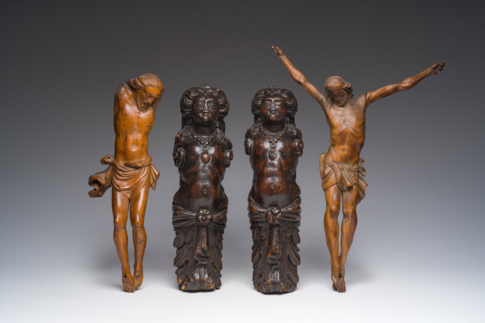 A pair of patinated wooden caryatids and two Corpi Christi, 17th C. and later (1 of 12)