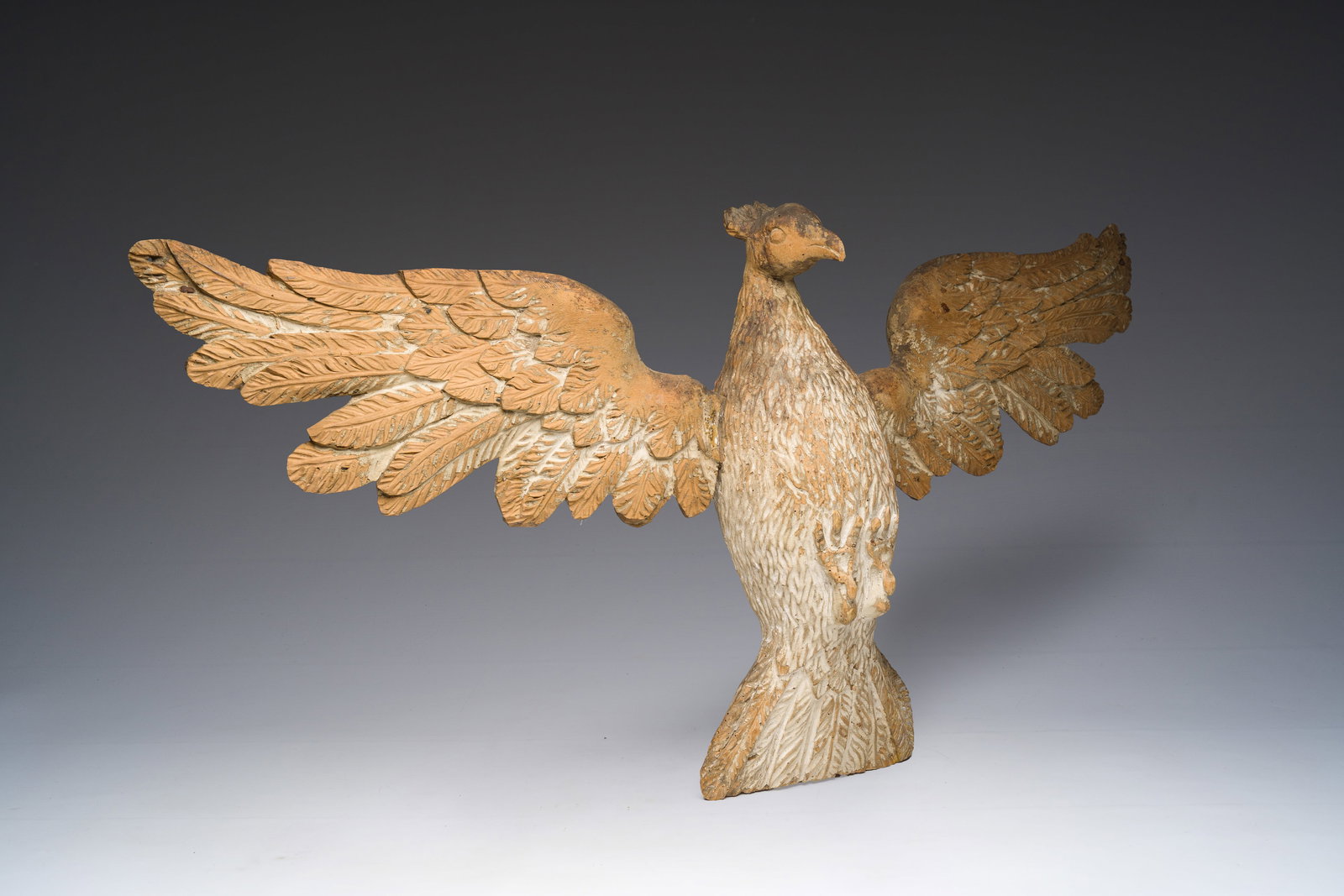 A large German patinated and carved wooden 'Holy Spirit' sculpture, 19th C. (1 of 5)