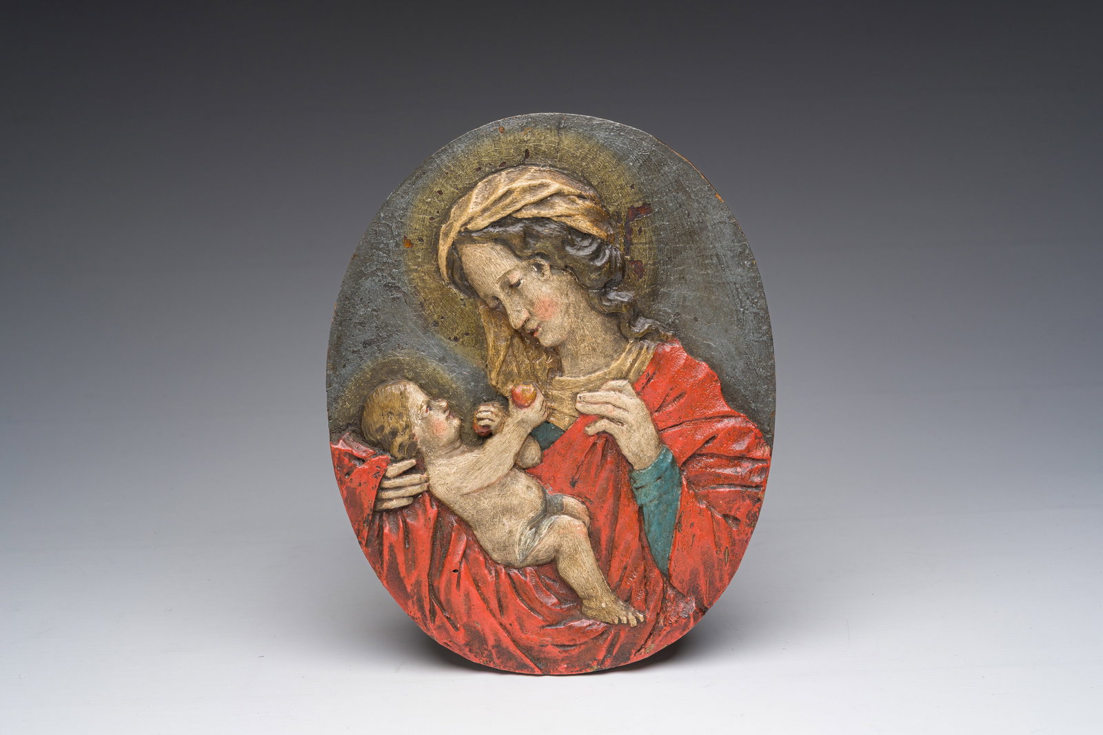 An oval polychromed wooden Virgin and Child relief, probably Tyrol, Austria, 18th C. (1 of 2)