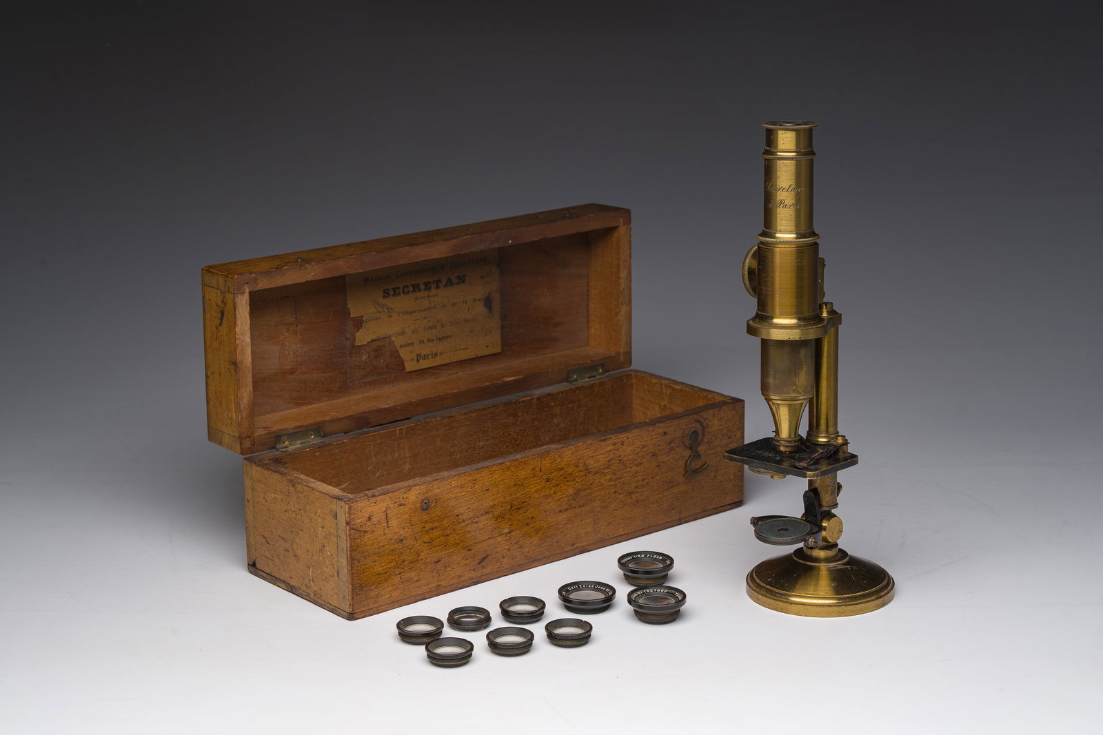 A French brass 'Secretan a Paris' barrel microscope with its accompanying wooden storage box, 19th (1 of 13)