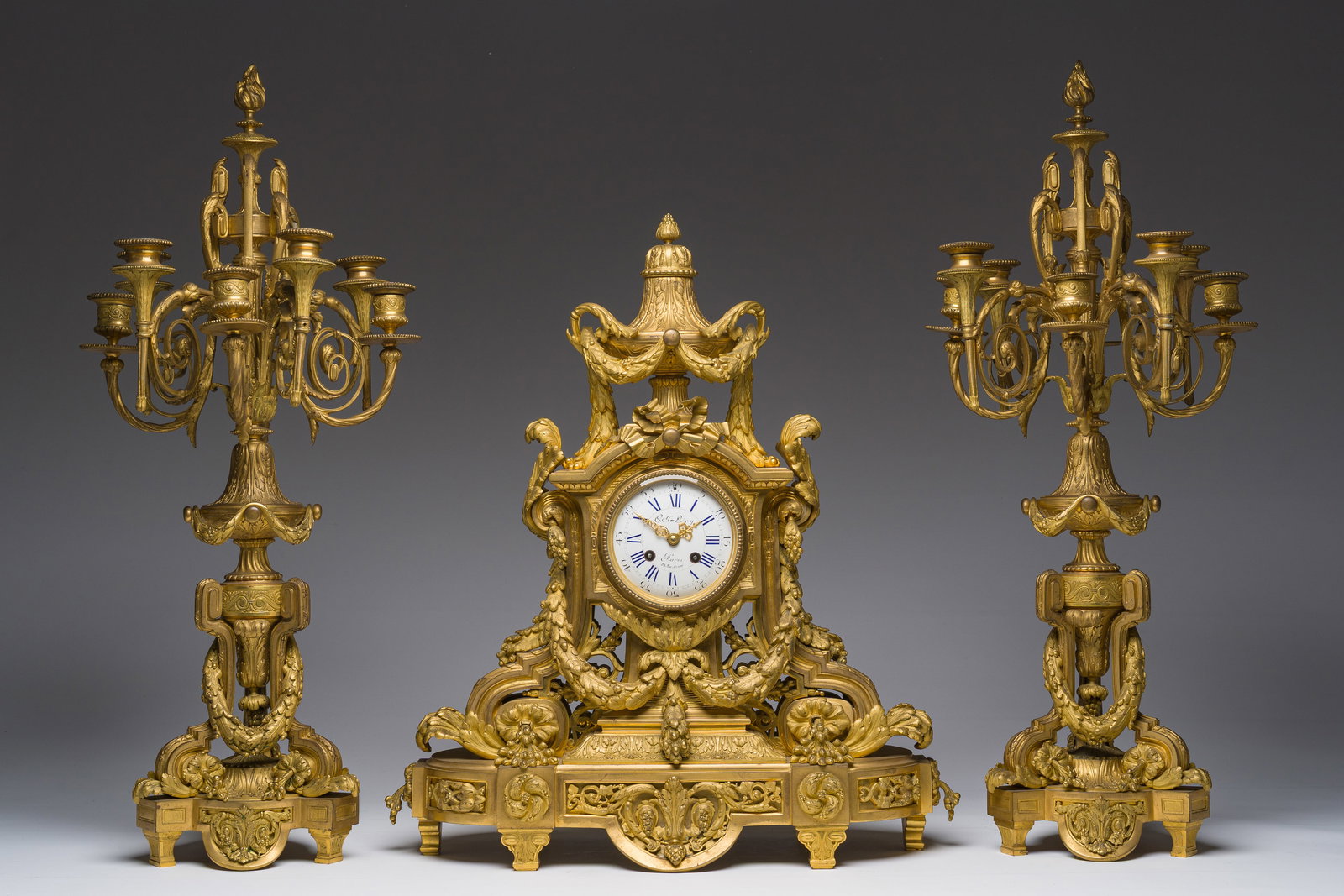 A French Louis XVI style gilt bronze three-piece clock garniture with garlands, 19th C. (1 of 15)