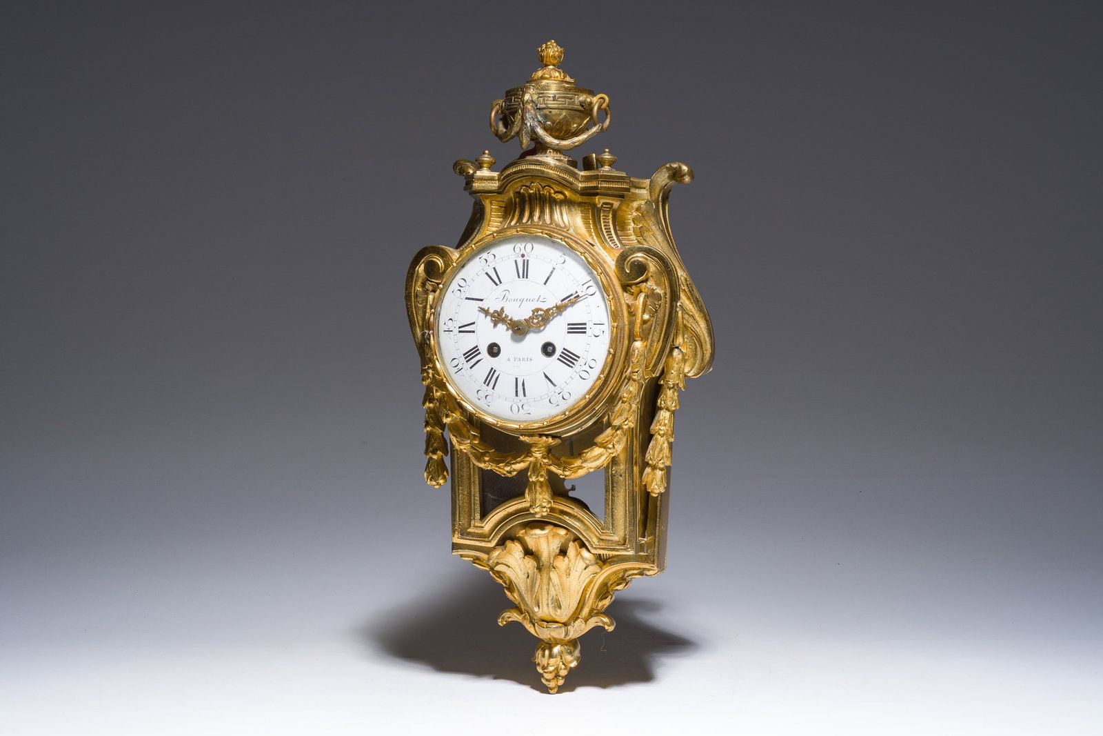 A French gilt bronze Louis XVI style cartel clock with garlands, 19th C. (1 of 8)