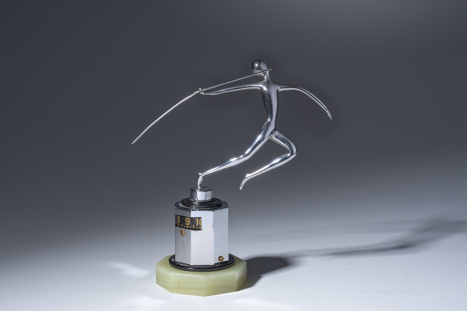 A rare Jaeger LeCoultre chrome-plated metal 'partner duo' desk clock crowned with a javelin thrower: A rare Jaeger LeCoultre chrome-plated metal 'partner duo' desk clock crowned with a javelin thrower on an onyx marble base, 1930s H 22 cm