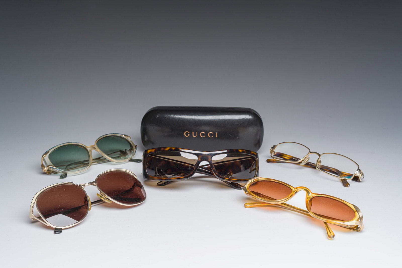 Four various sunglasses and a pair of reading glasses, Bulgari, Christian Dior, Gucci and Yves Saint (1 of 3)