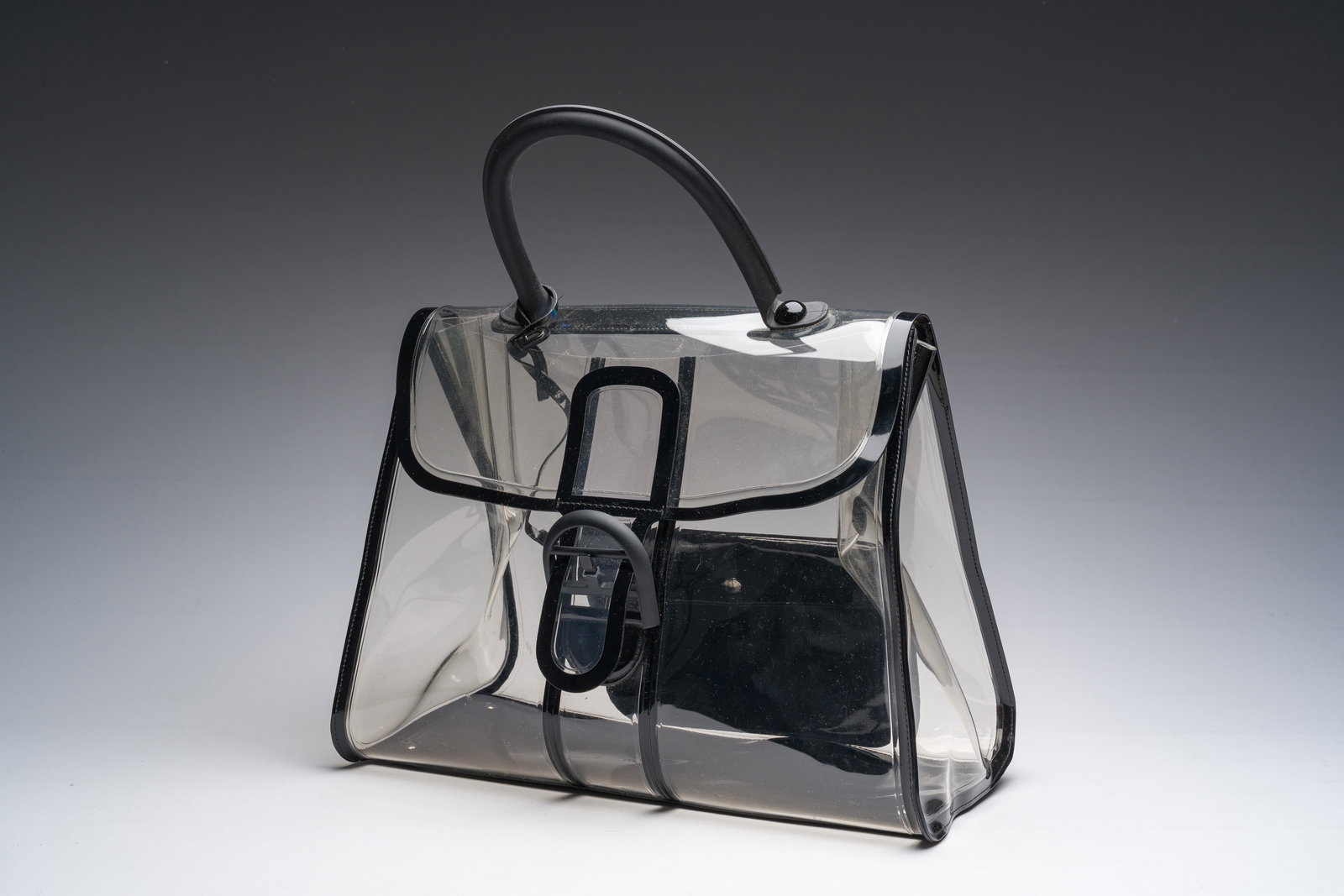 A Belgian Delvaux 'Brillant X-Ray' handbag in transparent PVC with black leather details, 21st C. (1 of 9)