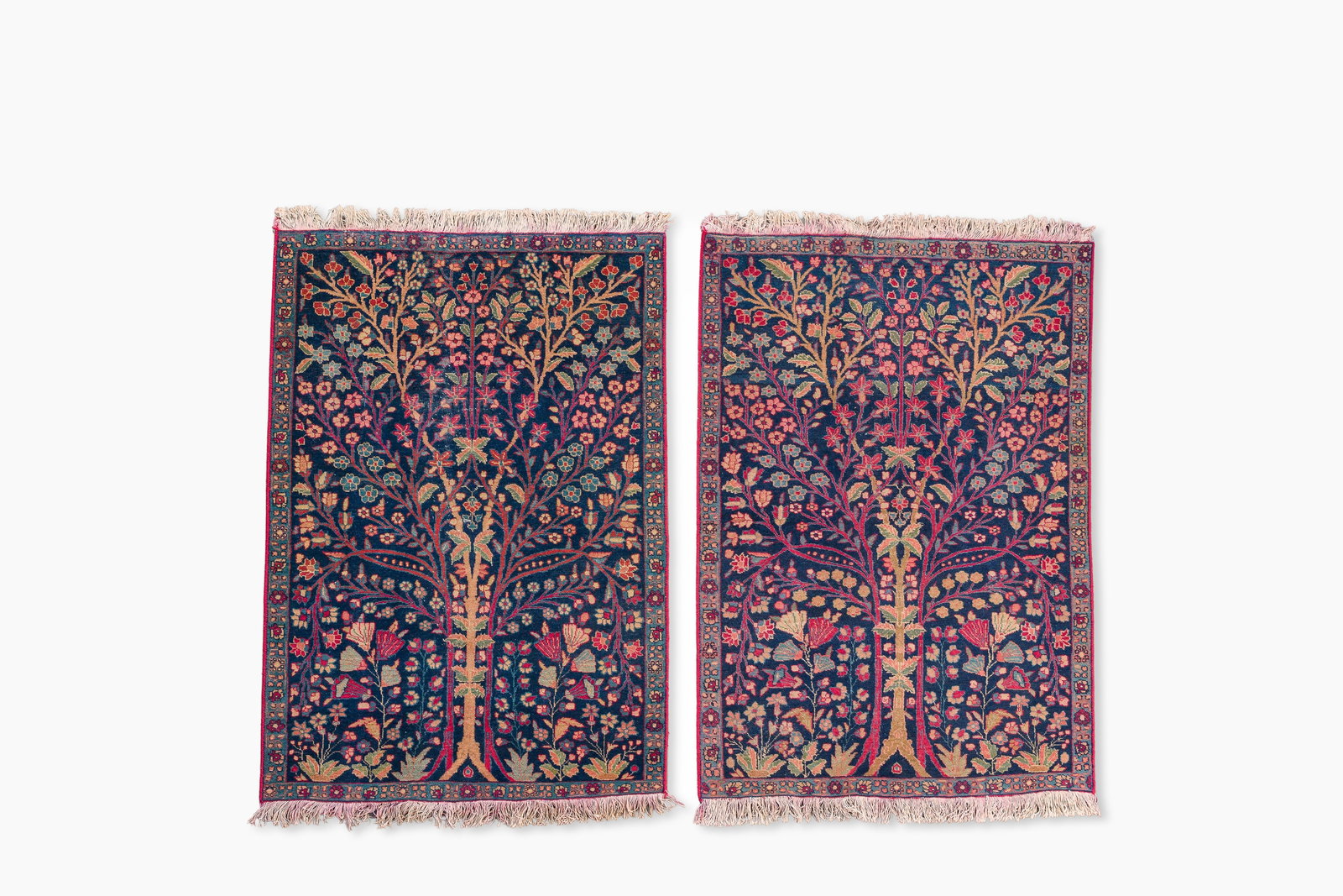 A pair of Persian Kerman (Kirman) rugs with floral design, wool on cotton, 20th C. (1 of 5)