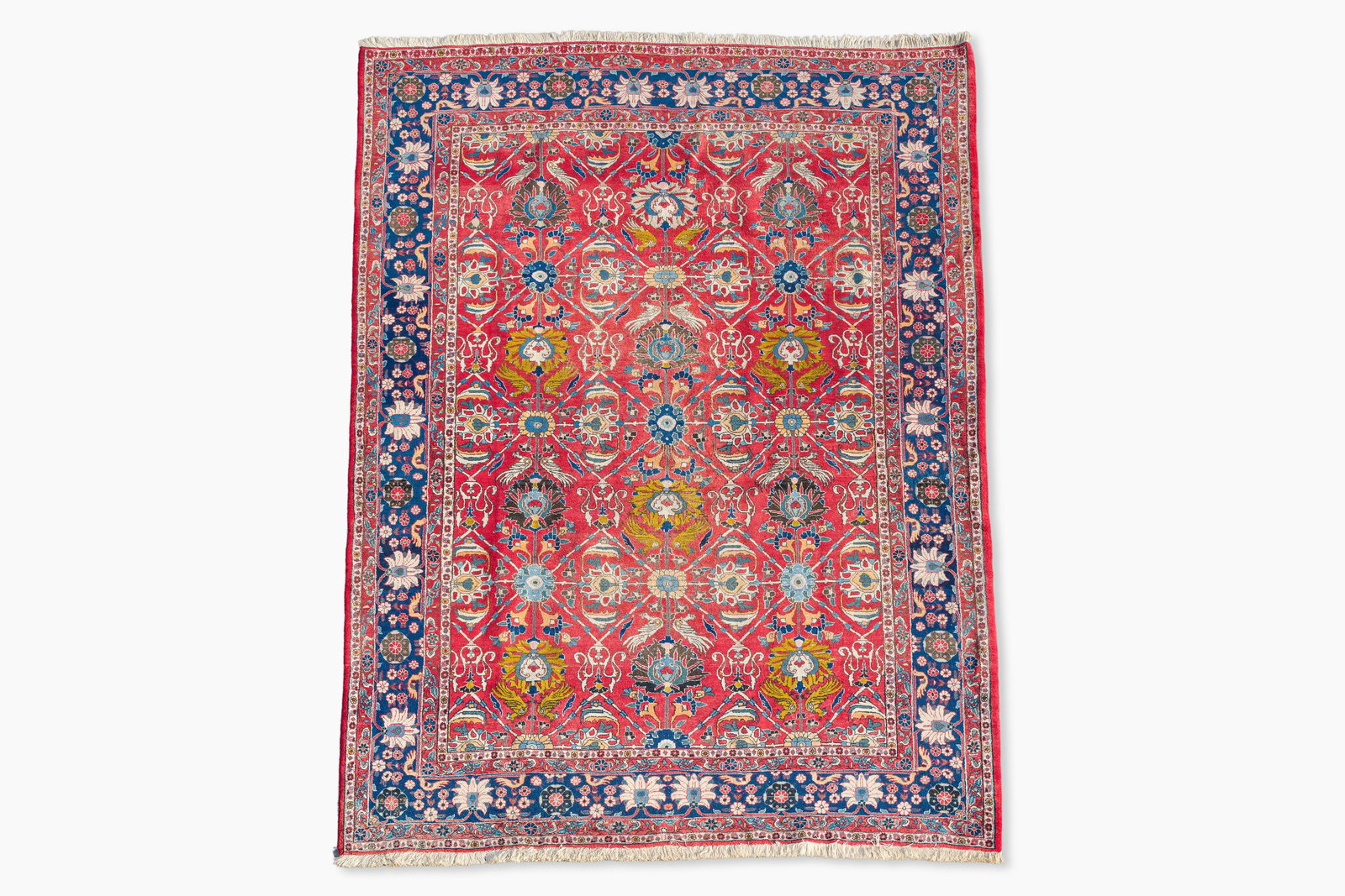 A Persian Varamin rug with floral design, wool on cotton, 20th C. (1 of 5)