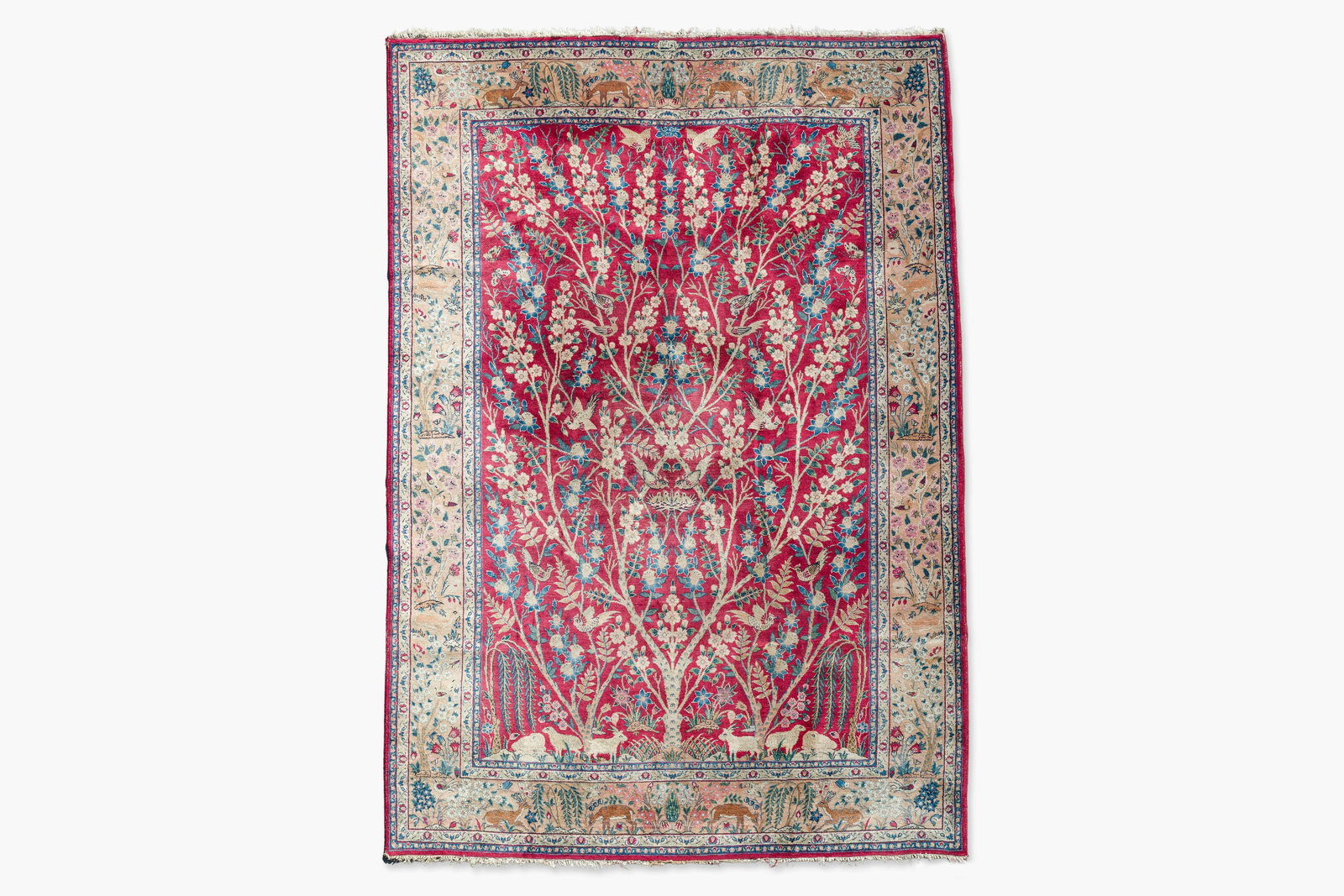 A Persian Tabriz 'tree of life' rug, wool on cotton, mid 20th C. (1 of 9)