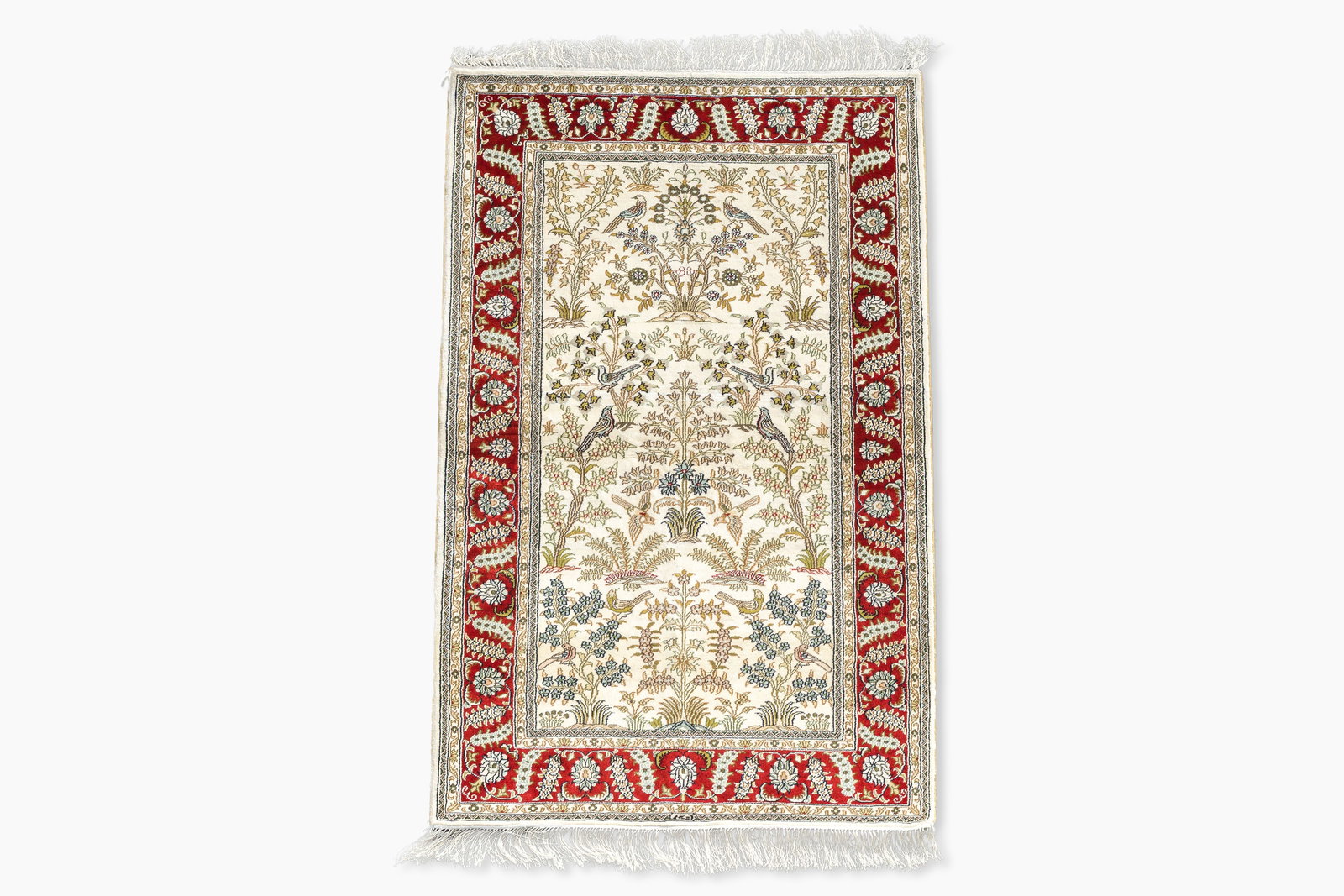 A Chinese silk Hereke style rug with birds among blossoming branches, 20th C. (1 of 6)