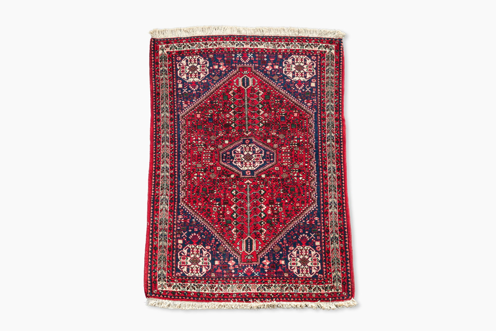 A Persian Abadeh rug with geometric floral design, wool on cotton, 20th C. (1 of 5)