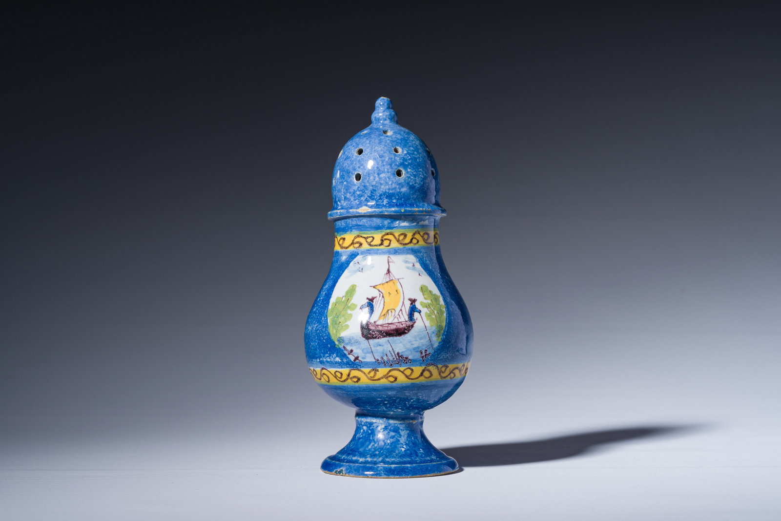 A polychrome Brussels faience caster with an animated river landscape, 18th C. (1 of 6)