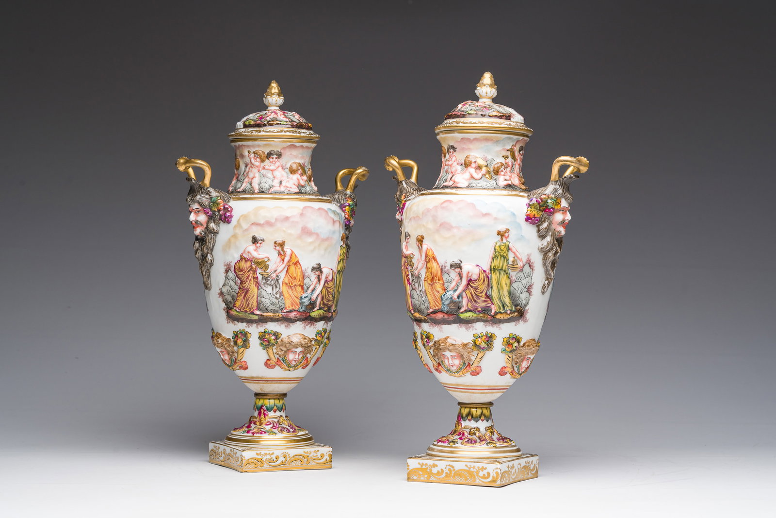 A pair of Italian polychrome and gilt Capodimonte porcelain vases and covers with relief design (1 of 11)