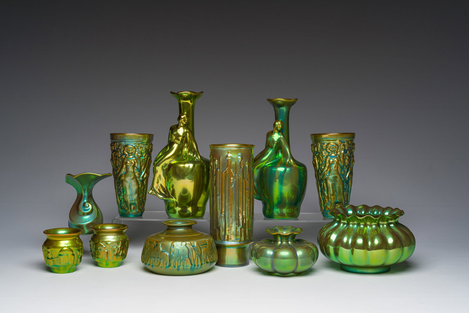 Eleven Hungarian Zsolnay Pecs eosine glazed vases and bowls with relief design, 20th C. (1 of 3)