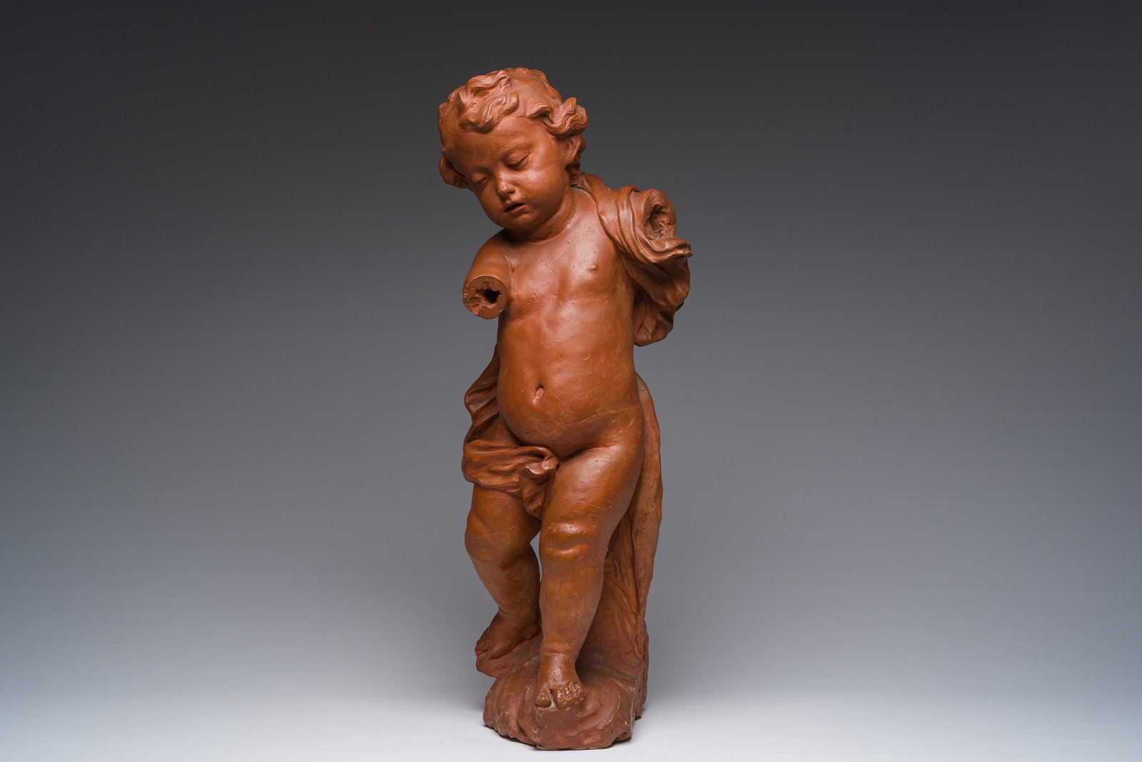 A Flemish patinated terracotta figure of a standing putto, 18th C. (1 of 10)