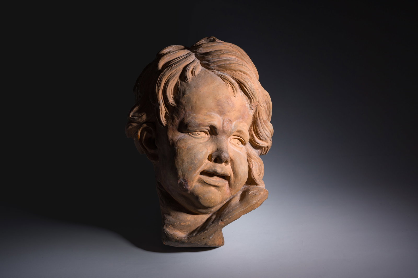 Jan Pieter van Baurscheit II (1699-1768): Head of a youth after Francois Duquesnoy (1597-1643),: Jan Pieter van Baurscheit II (1699-1768): Head of a youth after Francois Duquesnoy (1597-1643), patinated terracotta, monogrammed H 39 - L 24 - D 15 cm