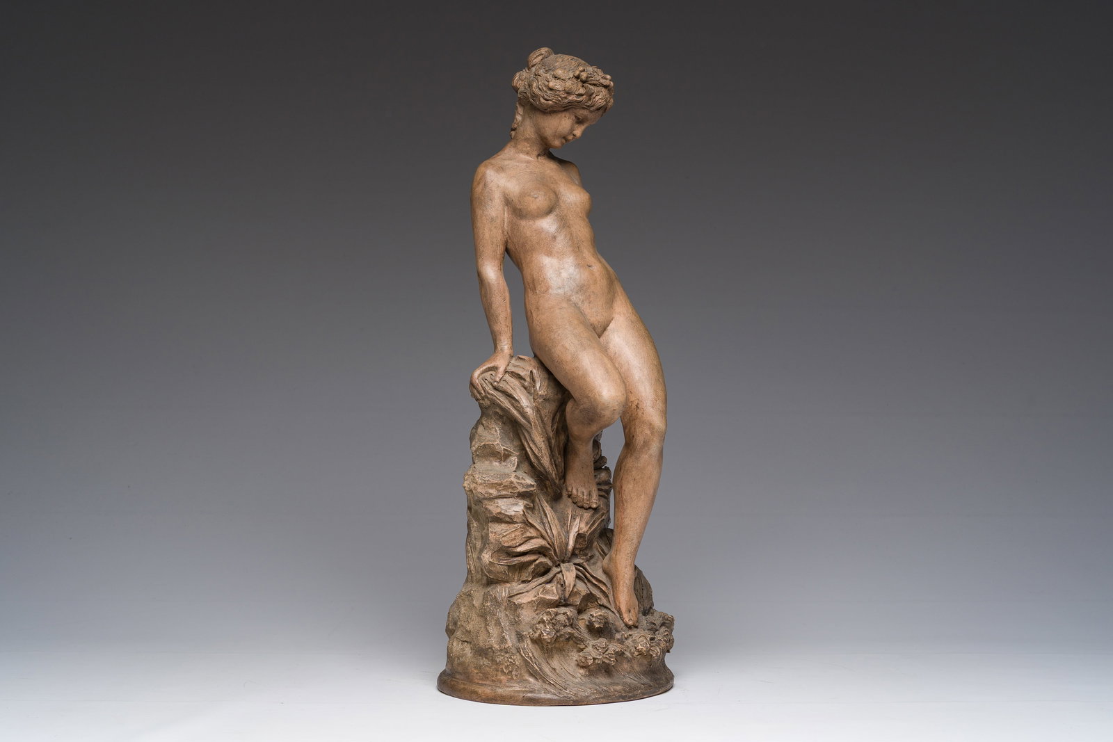 Claude Michel (Clodion, 1738-1814, after): A nymph leaning on a rock, patinated terracotta, 19th C. (1 of 8)