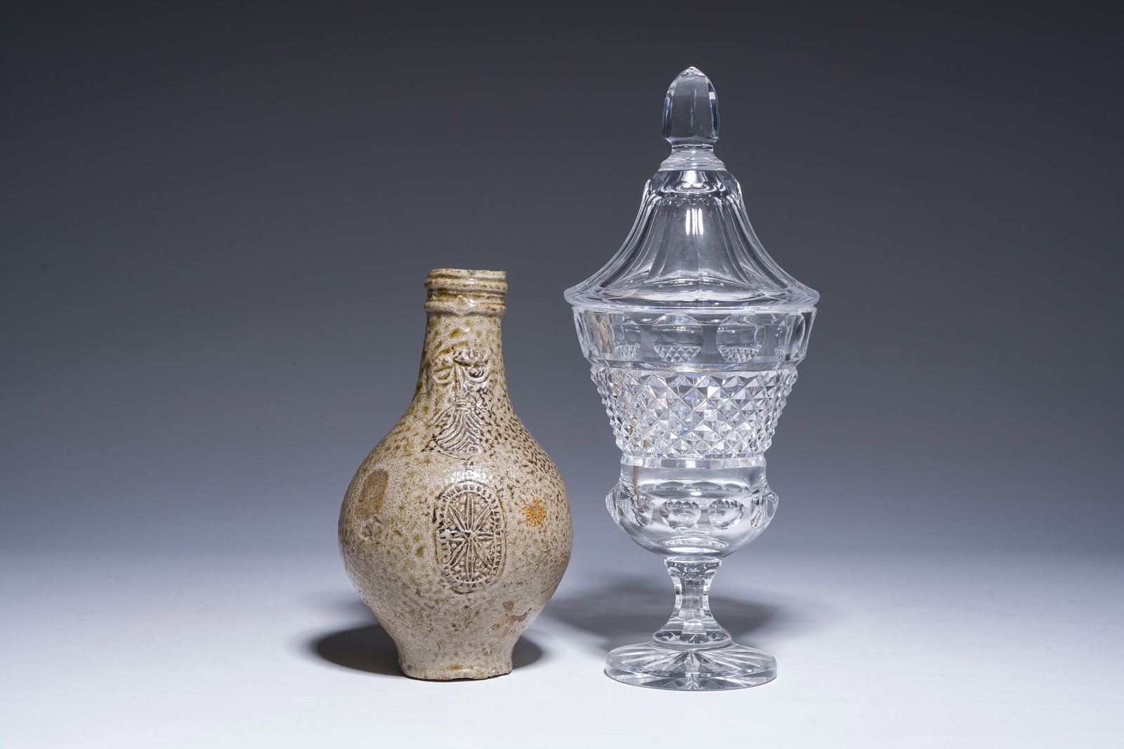 A German stoneware bellarmine jug and a crystal bonbonniere, 17th C. and 19th C. (1 of 16)