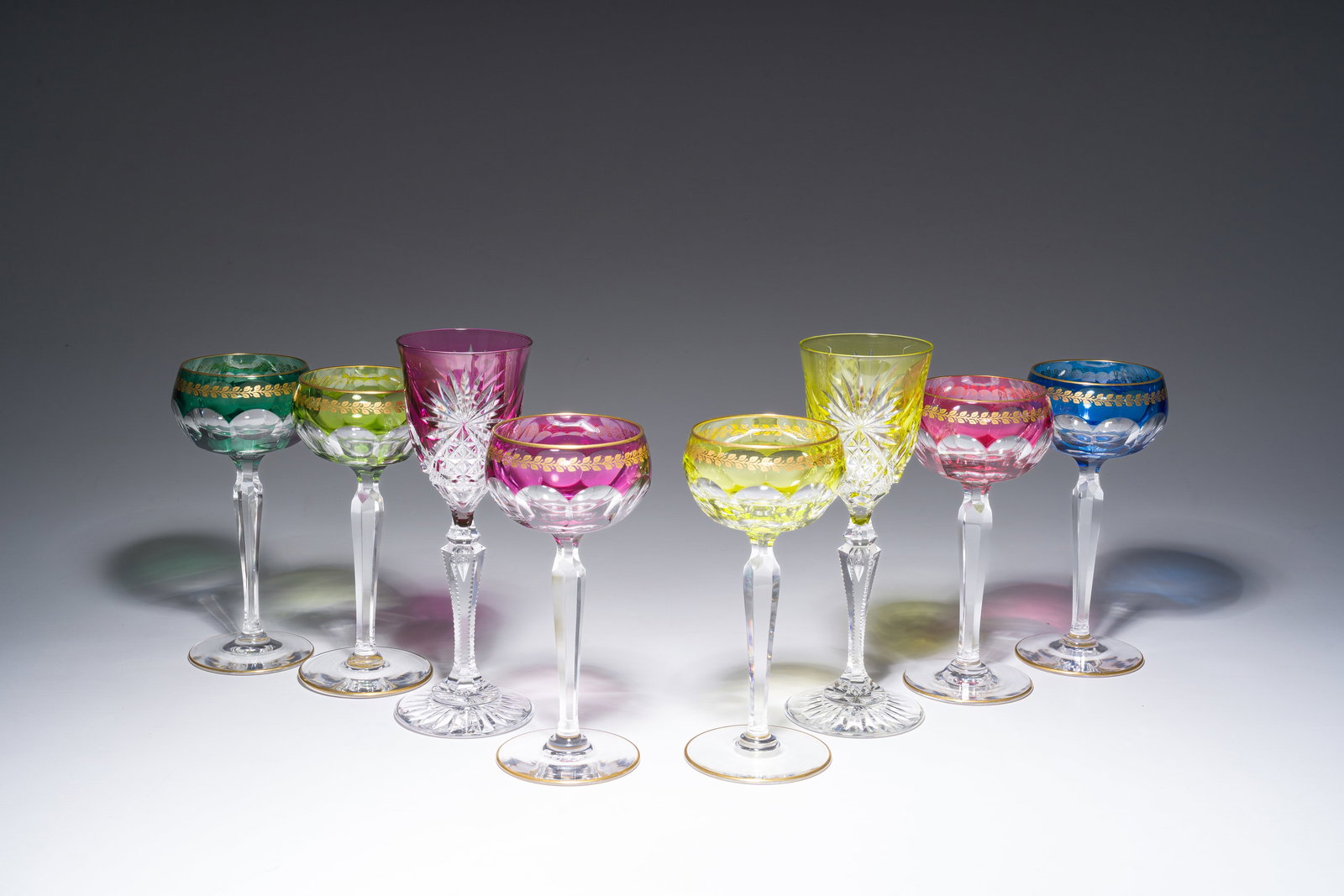 Eight partly coloured overlay cut crystal glasses, six of which with gilt design, Belgium, Val Saint (1 of 7)