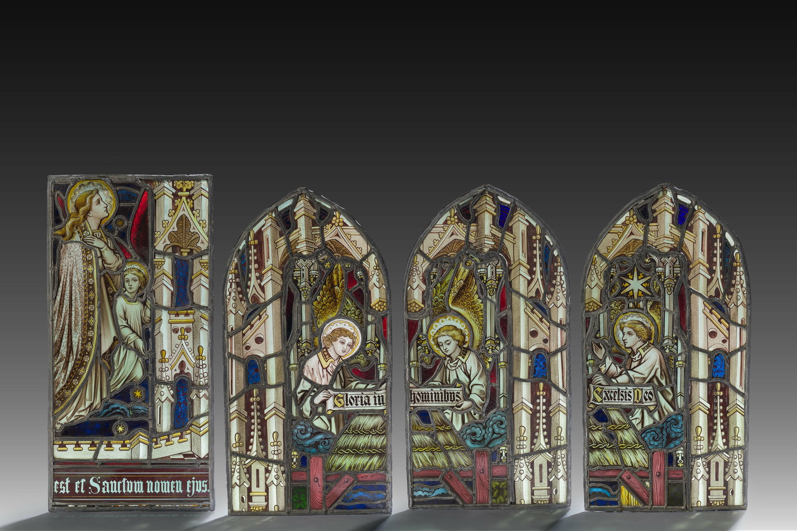 Four Gothic revival painted and stained glass windows with religious representations, 19th C. (1 of 7)