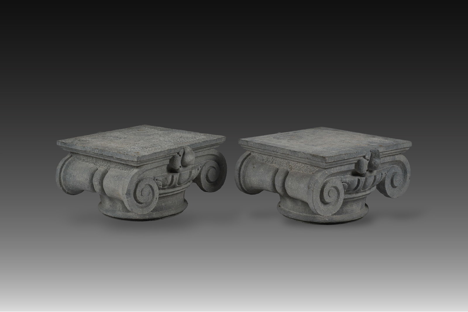 A pair of presumably French carved bluestone Ionic capitals, 19th C. (1 of 7)