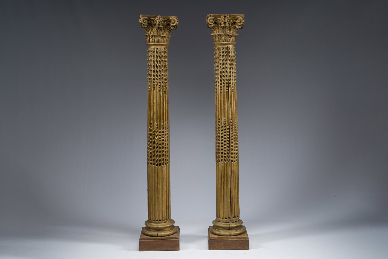 A pair of richly carved gilt wooden columns with Corinthian capitals, 19th C. (1 of 9)