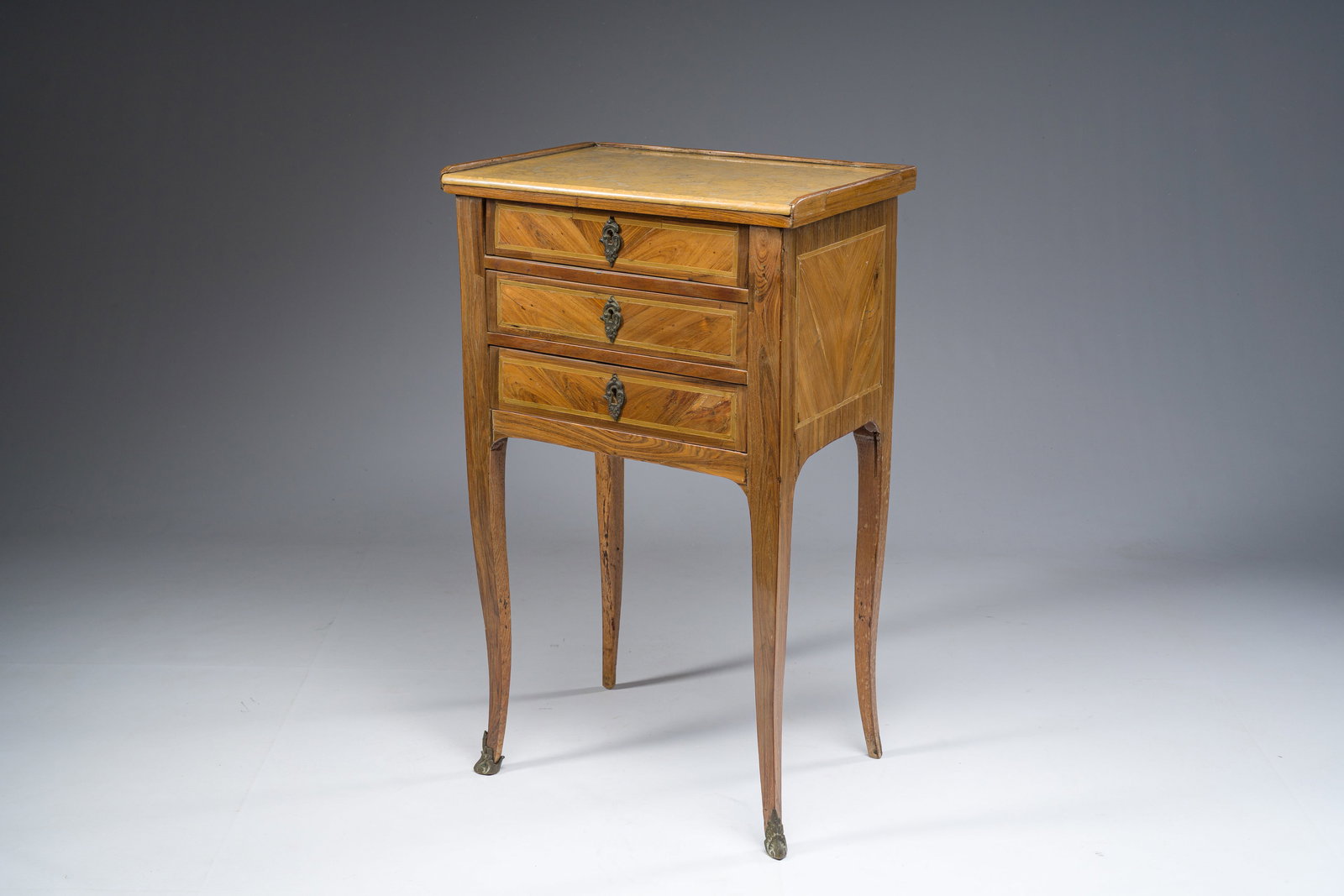 A French Transition bronze mounted marquetry side table with yellow marble top, 18th C. and later: A French Transition bronze mounted marquetry side table with yellow marble top, 18th C. and later H 71 - L 43 - D 31 cm Provenance: - Ex-collection Finck, there acquired by the current owners in June
