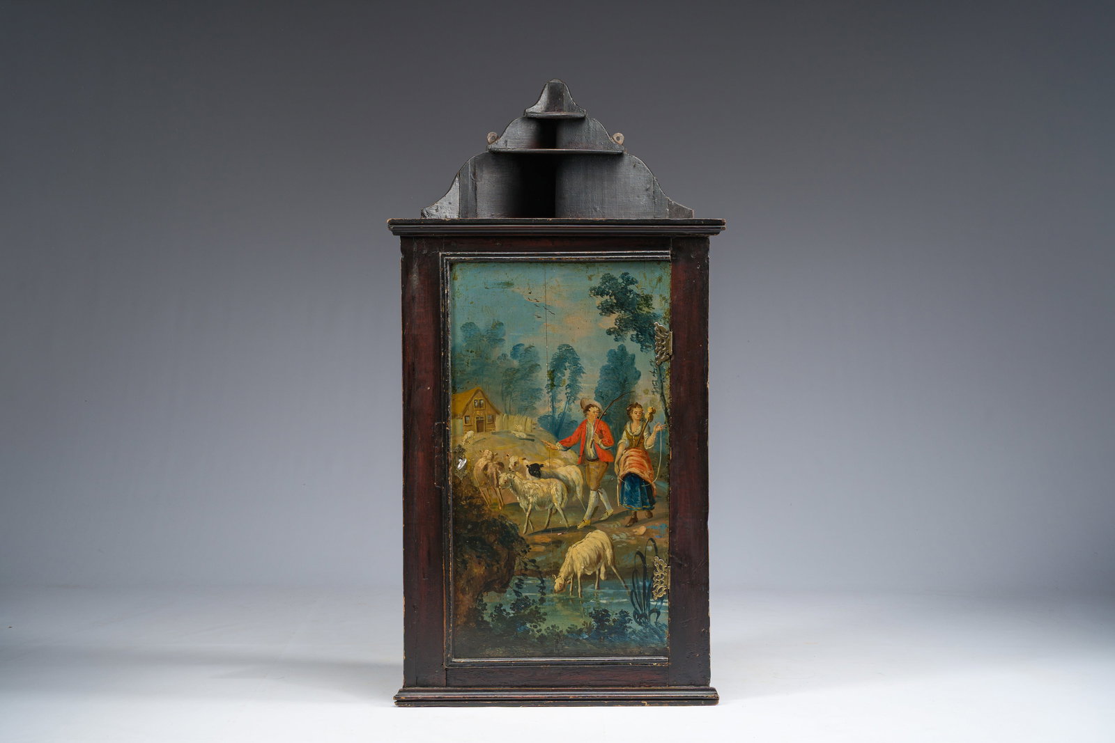 A Dutch polychrome painted wooden hanging corner cupboard with a pastoral scene, Ameland, 18th C. (1 of 6)
