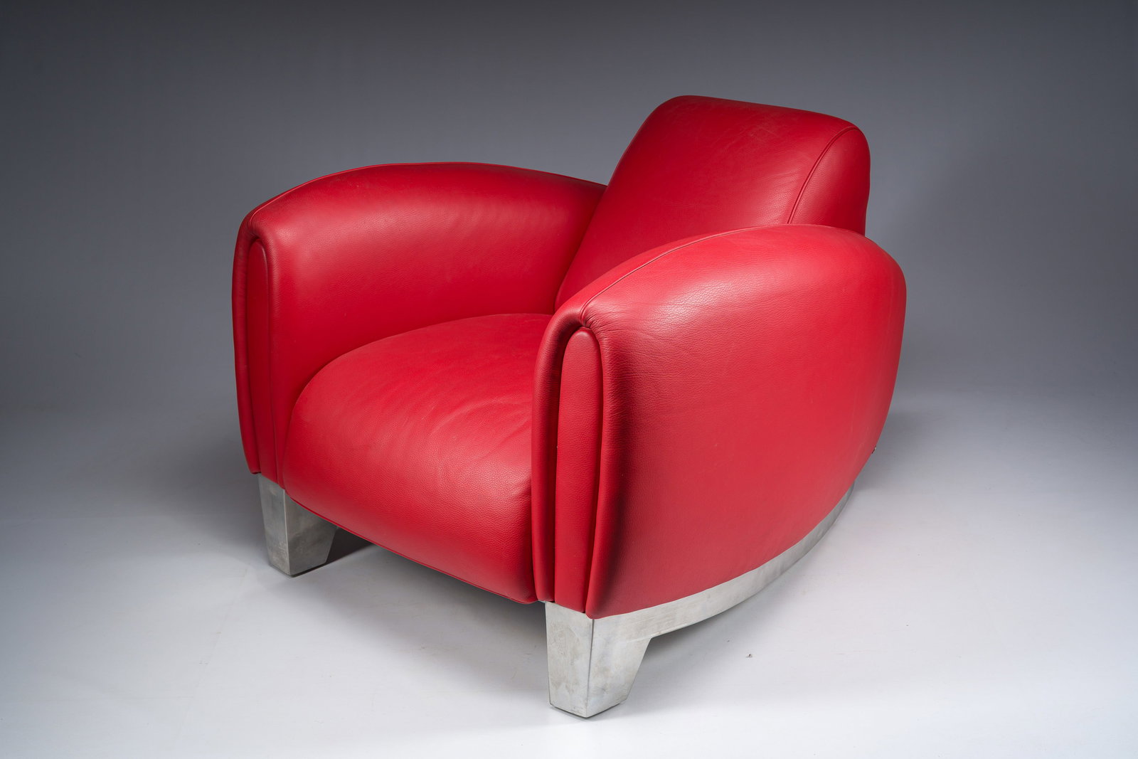 Franz Romero (1951): A red leather and polished aluminium DS-57 Bugatti lounge chair, De Sede, (1 of 7)