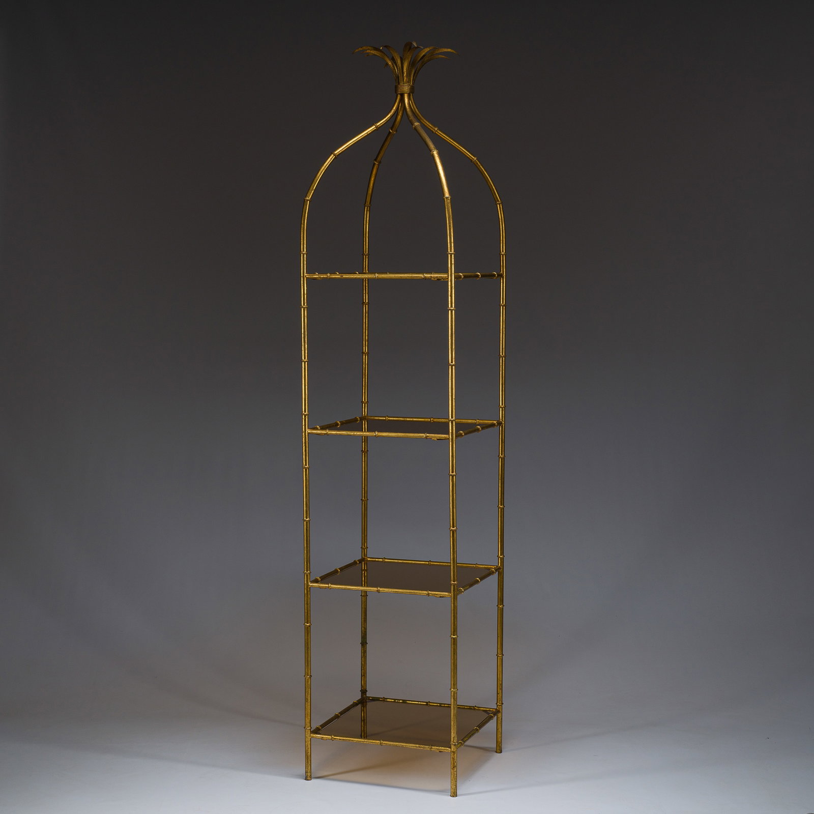 A four-tier pseudo bamboo shelf in gilt metal a d smoked glass, circa 1960 (1 of 7)