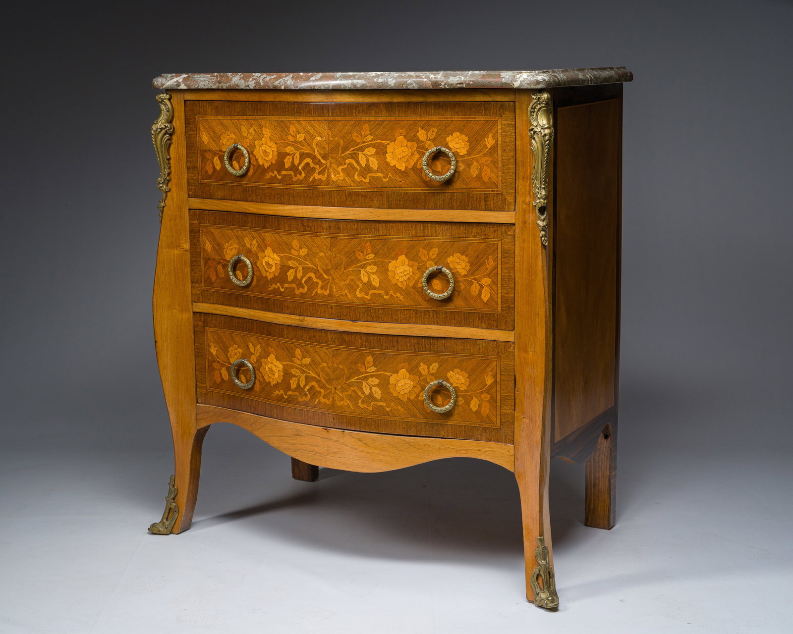 A French Transition style gilt bronze mounted marquetry chest of drawers with veined grey and red (1 of 10)