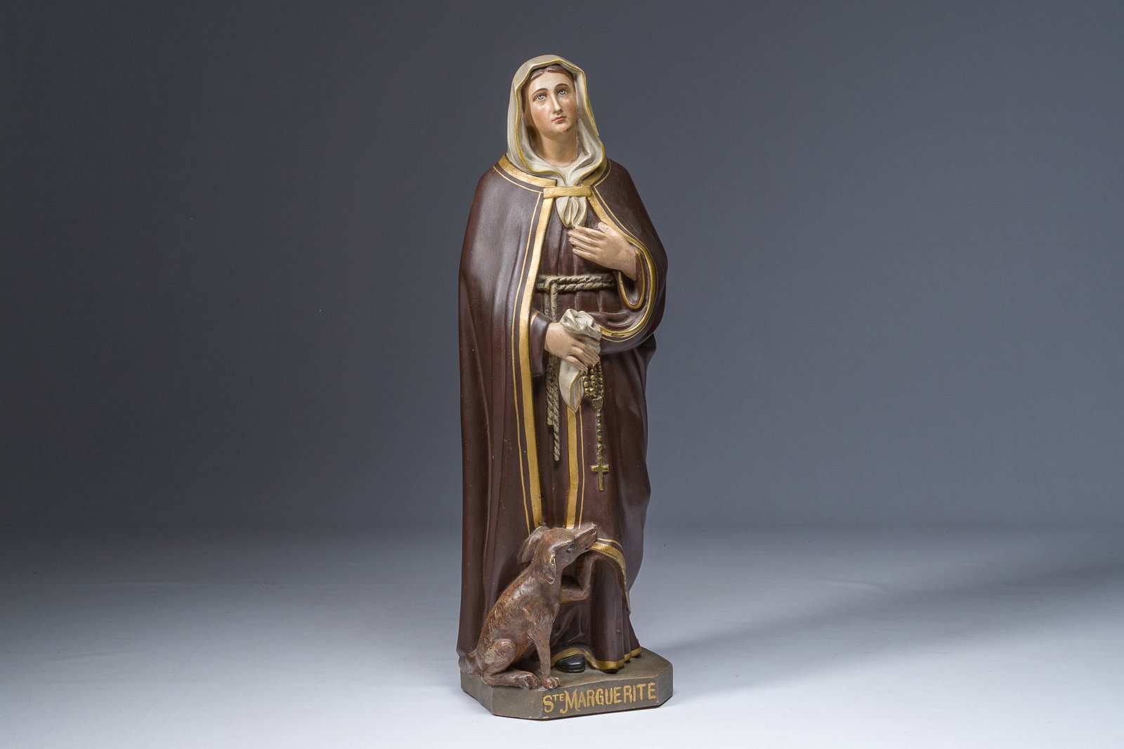 A polychrome decorated plaster figure of Saint Margaret with her dog, 19th/20th C. (1 of 10)