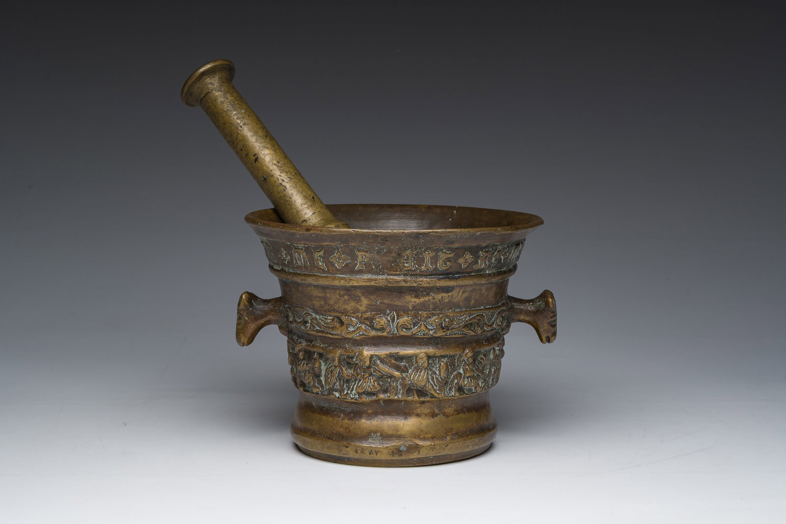A Flemish bronze mortar with relief design and animal head-shaped handles with pestle, Petrus Van (1 of 8)
