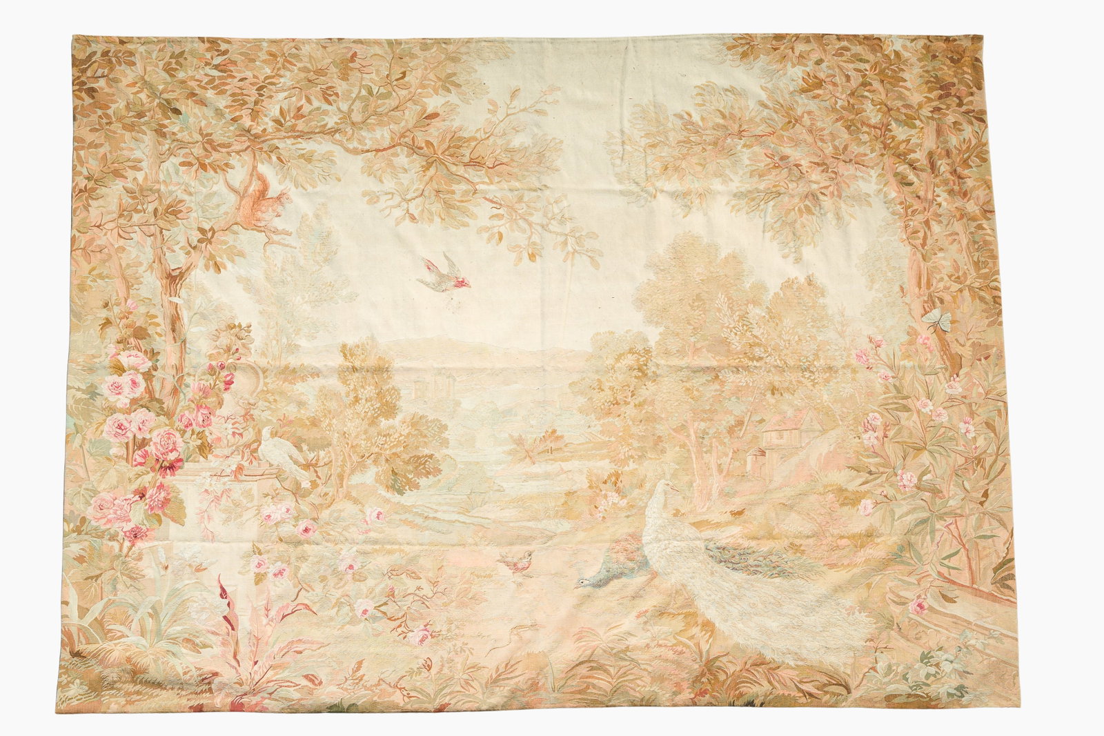 A French Aubusson wall tapestry with peacocks and a squirrel in a floral paradise, 19th/20th C.: 324 x 254 cm Provenance: - Ex-collection Kasteel Herlegem te Kruishoutem - Herlegem Castle in Kruishoutem - Château d'Herleghem à Kruishoutem (Family van Pottelsberghe de la Potterie-de Lani