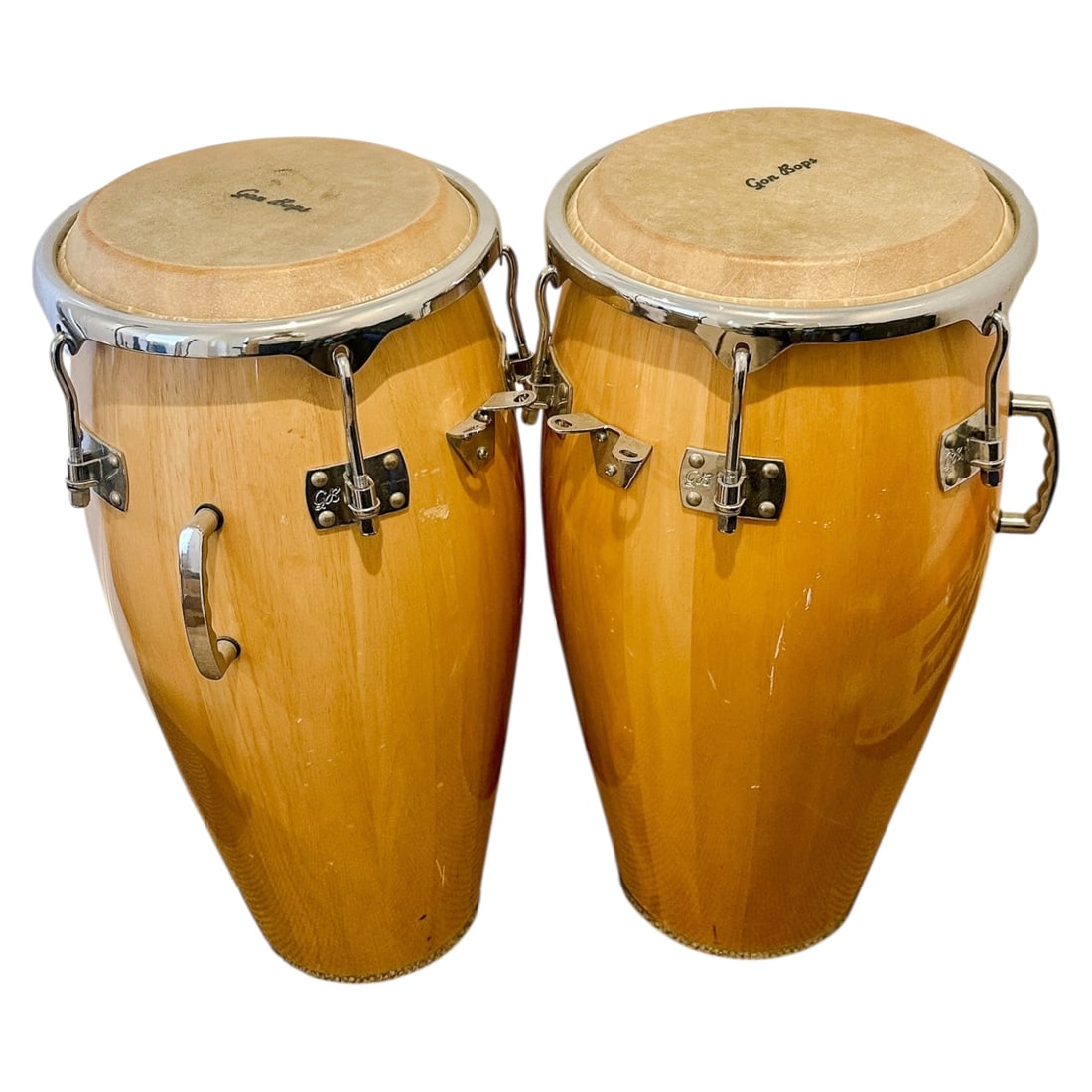 Conga Drums Set: This conga drum set delivers deep, vibrant sound and traditional Latin rhythm, perfect for stage, studio, or home play. Crafted with quality materials and classic styling, the set includes two matched