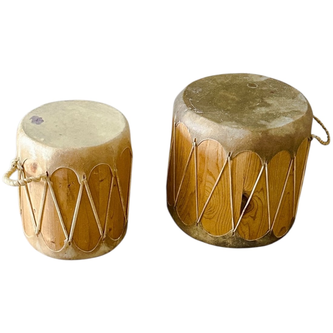 Set of 2 Native American Log Drums: This handcrafted set of 2 Native American log drums showcases traditional design and cultural artistry. Made from hollowed wood with natural hide drumheads, each piece offers deep, resonant tones and